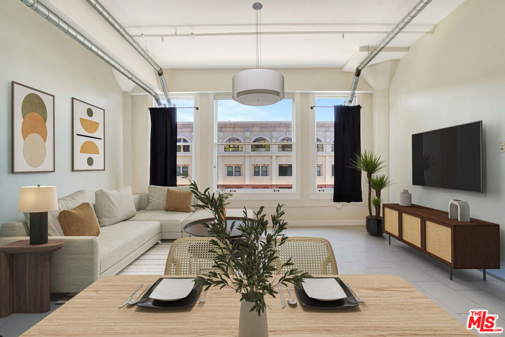 (VRBO/Airbnb Approved for Short Term Rentals) Beautifully updated, contemporary NY Style Urban loft in DTLA's former "Western Costume Building" an Architectural Historic Gem from Old Hollywood. Built in 1924 where some of the greatest "Fits" of Hollywood's Golden Era were created. Where DTLA's Historic Core meets The Fashion District, just a few blocks from South Park. Enjoy inspiring sunrises and beautiful city views from this east facing upper floor loft. 939 Broadway #802 features a huge original floor-ceiling picture window allowing in tons of natural sunlight making this loft SUPER BRIGHT. One of the few (IF NOT THE ONLY) Downtown condo buildings approved for SHORT TERM RENTALS. That means OPENLY using the loft for Airbnb & VRBO weekend rentals! The potential with the Olympics around the corner is tremendous. While just 675sf, this urban oasis feels MUCH BIGGER with a proper bedroom (demising wall) with large "dual entrance" ensuite bath, high ceilings, washer/dryer, central AC/Heat and chefs kitchen with stainless steel appliance package and contemporary countertops & backsplash. Designer Rooftop Resort package with stunning DTLA Skyline views: Pool, Hot tub, BBQ, Sundeck, Cabana's and a Small fitness Center. Gorgeous historic lobby with 24 hr security! Keep the car parked because everything City Center has to offer is right here: enjoy dinner & drinks at the buildings anchor tenant & trendy restaurant/lounge "Zinque" along with the popular desert market "Kream". Directly next door since 1927 sits "The United Artists building" a historic downtown architectural relic and former home of The Ace Hotel. Check out Moonlarks Diner, Boutique Hotels The Hoxton & Stile, Urban Outfitter, CVS, Whole Foods, Ralphs, LA Live, The Row and so, so much more, its all right here!!