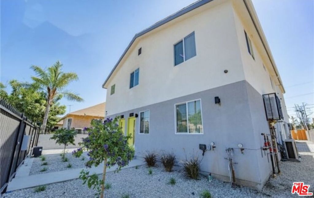 Contemporary Fourplex! This remarkable property features two distinct buildings. The front building is two stories high and includes two units, each offering three bedrooms and two bathrooms. The back building showcases a tri-level design with side-by-side units: one containing four bedrooms and three bathrooms, while the other boasts seven bedrooms and five bathrooms. All units are designed with highly desirable floor plans in a townhome style, complete with en-suite bathrooms and master bedrooms. Expansive windows flood the interiors with natural light, and additional highlights include walk-in closets, custom window blinds, stainless steel appliances, two-tone interior paint, and energy-efficient LED lighting. Each unit also comes with its own laundry room, tankless water heaters for instant hot water, and energy-saving HVAC systems.Ample parking is available, featuring decorative pavers, an attached garage, and an automatic gate opener. The property is well-maintained, with drought resistant landscaping and includes solar panels, ensuring it is self-sustainable with minimal maintenance costs. Each unit is individually metered, and an EV charging connection is provided in the garage. This attractive property is easy to rent and is centrally located near Downtown Los Angeles, USC, and major public transportation routes. With no rent control and increasing demand for rentals in the area, this building presents a great investment opportunity.