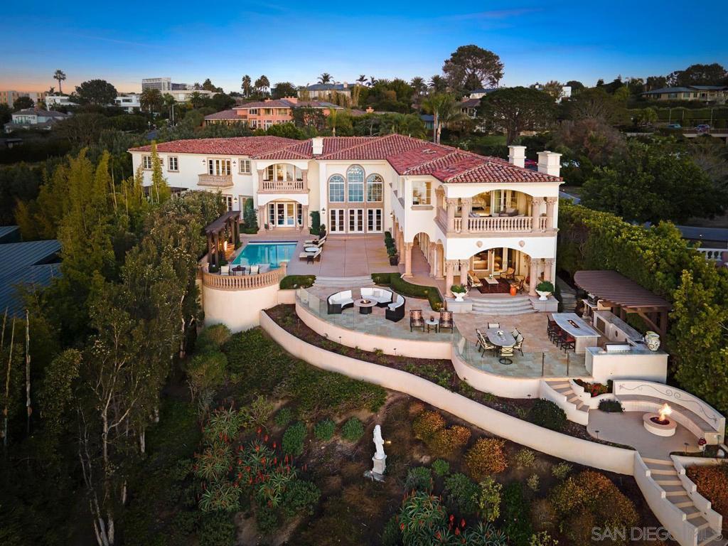 Serenely perched on a private bluff above the Pacific Ocean, this exceptional first time to market La Jolla Farms estate blends world-renowned design, unobstructed ocean views, and absolute privacy to create a striking, yet idyllic retreat. Masterfully designed, meticulously constructed, exuding contemporary class and grandeur, this estate boasts cinematic ocean and coast views from every room, while soaring windows and abundant natural light amplify the elegant living spaces... This original owner gated Mediterranean estate invites easy enjoyment of its many remarkable amenities. The home features a 2-story home gym, custom office, extensive game room/lounge, and a spacious garage that would impress any car enthusiast. The sprawling patio/yard is an entertainer's paradise, including built in BBQ and bar, custom designed pool/spa, multiple fire pits/features, luscious lounge/garden, and countless sitting areas all with front row views of the Pacific Ocean. Owner spent over $500k landscaping hillside into a tranquil sitting area with fire pit, and adding a beautifully transparent curved glass wall to maximize the unobstructed ocean view. Enjoy morning coffee or an evening sunset while watching the waves crash at famed Black's beach. Neighborhood protected by the La Jolla Farms Security Patrol. Equipment: Garage Door Opener,Pool/Spa/Equipment, Range/Oven Sewer: Sewer Connected