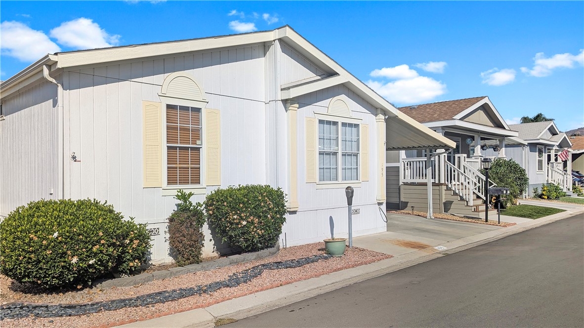 Welcome to Riverside Meadows, a 55+ Community in the City of Riverside. This well-maintained 1998 Fleetwood, Sunpointe(Model) manufactured home is turnkey and has 3 bedrooms and 2 bathrooms and a Den at 1469sq. ft. of living space (approx.). As you enter the home from the large front porch you are greeted with the large open floor plan, living room, kitchen, and dining area. The large master suite with a walk-in closet has an adjoining bathroom with double vanity sinks and a walk-in shower and separate tub. Home will be delivered furnished. Additional features: high-quality hardwood flooring in kitchen, fans, a laundry room with space for a full-size washer/dryer, also two sheds will be included with the sale. Riverside Meadows has a beautiful clubhouse with a heated swimming pool, fitness center, and large sitting area with a fireplace, and is close to the 91 freeway, Hospitals, and Shopping Malls.