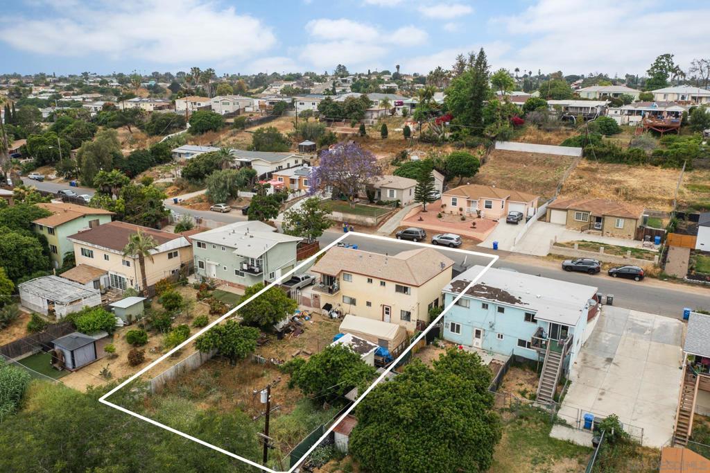 Rare opportunity to build 2 additional ADU's right away in Lemon Grove! Shovel ready with permits in hand. Top unit of duplex is light and bright featuring 3 bedrooms and 1.5 bathrooms, large front patio, spacious living area and primary. Bottom unit has 2 bedrooms and bathroom, direct access to huge yard with an attached garage. Long driveway leads to the backyard making it easy to build ADU's in the back. Permits for the 2 ADU's are 2 bed/1 bath 748 sq. ft. Lots of potential on this lot! Call LA with any questions!