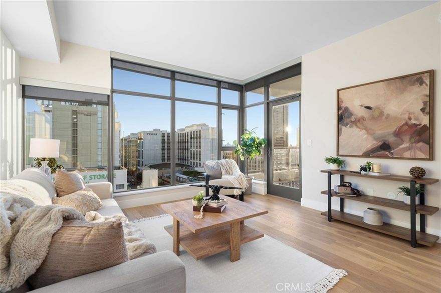Stunning renovation just completed on this light-filled 7th-floor corner condo with sweeping downtown and bay views. The open layout features floor-to-ceiling windows, quartz countertops, stainless steel appliances, and modern designer finishes throughout. The primary bedroom provides a calm, comfortable retreat, while the second room could work well as a guest space or home office. The bathrooms offer sleek, contemporary design. Building amenities include a pool, fitness center, clubhouse, secure assigned parking, and guest parking. This home delivers sophisticated urban living steps from San Diego’s best restaurants, cafés, and entertainment.