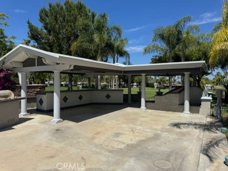 Nestled among the foothills of SoCal Palomar Mountain and a short distance from Temecula Wine Country, Rancho California RV & Golf Resort *Lot 388* provides the opportunity to enjoy the RV Resort Lifestyle at its finest! This developed lot features a beautiful alumawood patio cover providing an outdoor kitchen, as well as a Washer & Dryer, expansive bar seating area and sunken living/fireplace sitting area with shade screens to enclose the space. Outdoor BBQ station is at the front of the lot with additional conversation sitting area. The lot is surrounded by raised planting beds and beautiful palm trees. The size of the lot accommodates large rigs while offering plenty of vehicle and golf cart parking. Beautiful VIEWS of the green space, mountains, golf course and water! Rancho California RV Resort provides amenities such as a 14 hole Executive PAR 3 Golf Course (no fees for owners), 5 Pools/Jacuzzis, Tennis courts, Pickleball courts, Dog park, Club house, hiking trails, Horseshoe lawn and onsite grocery market. The resort is guard gated with no age restrictions. Monthly HOA fee includes use of the golf course, amenities, trash pickup at lot, water/sewer and common area maintenance. If you are considering a premier Southern California RV Resort destination, don't miss out on visiting Rancho California RV Resort. *FINANCING IS AVAILABLE*