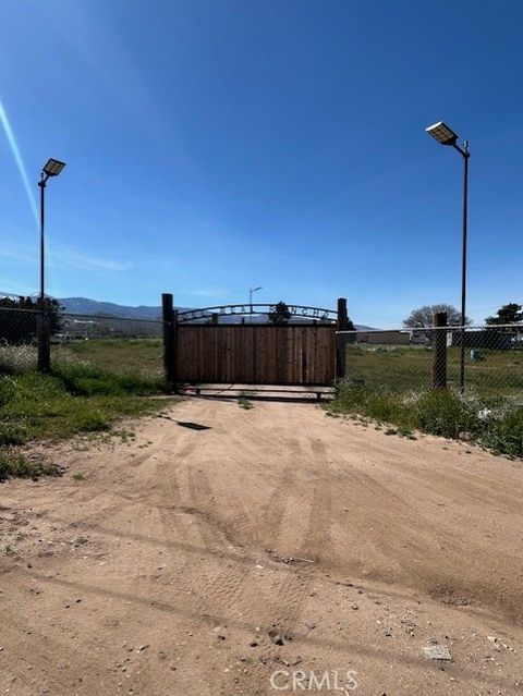 Photo of 6677 Snow Line Dr, Phelan, CA 92371 (MLS # HD26054545)