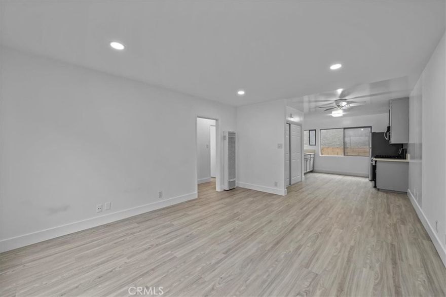 Welcome to this newly renovated light and bright two bedroom/one bathroom apartment. This spacious first floor unit is 866 square feet and is located on a very quiet street in the desirable Vista Del Oro neighborhood. Featuring all new kitchen appliances (refrigerator, microwave, and gas range), side by side washer and dryer, and 1-car garage, this unit is move-in ready! Large windows with views of the neighborhood give lots of natural light to each room. Don't miss out on this great opportunity! Please note that first month's rent, last month's rent and security deposit are due at signing.