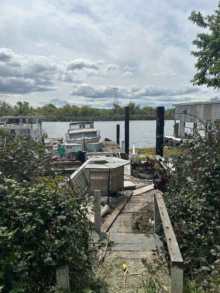 100,000 price reduction !! Welcome to Bethel Island! love water sports, quiet community, cherry picking in the summer, this home is waiting for your imagination to make it your home sweet home or vacation home!! 2 bedroom and 1 bath on the second floor!! first floor you can build extra 2 bedroom and 1 bathroom for your guest!! great price and investment for for first time home buyer/handy man/investors/flippers!! need lots of work both interior and exterior!! 1 boat dock and lots of parking in this 10,500 SQ FT lot!! easy commute to the surrounding cities and silicon valleys  sell!! sell!! sell!!    Although there is no garage, this property boasts a generous minimum lot size of 10,500 square feet, offering ample space for potential outdoor activities. The heating is categorized as "Other," and cooling is handled by ceiling fans and window/wall units. Please note, there is no laundry facility available on site. The home falls within the Oakley Union Elementary School District.