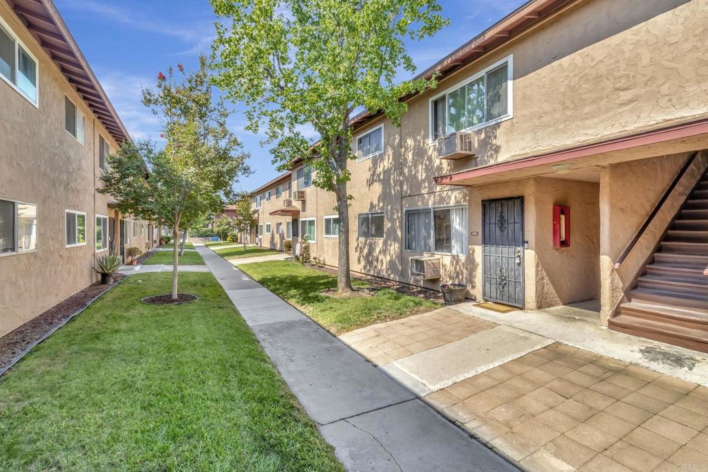 Perfect opportunity to break into San Diego market and become a homeowner under $400,000! Welcome to This Charming Lower-Level End Unit with Laundry, Parking & More! This 2-bedroom, 1-bathroom condo offers the perfect blend of comfort & convenience. Located on the lower level of a well-kept community with low HOA dues, this end unit boasts added privacy. Oversized private patio offering turf, wood decking a shade canopy and space for pets, little ones or relaxing w/ morning coffee or a BBQ in the night. The community offers well-maintained grounds, a sparkling pool, laundry facilities, and includes water, sewer, and trash in the HOA dues. Enjoy the ease of in-unit laundry, covered parking, additional open parking. Kitchen features Reto style tile flooring with sage green accents and upgraded appliances and new sliding glass door. Ideally situated near shopping, dining, and major freeways, this home offers peaceful living with unbeatable accessibility. Whether you're a first-time buyer, investor, or looking to downsize this property offers a great value and purchasing opportunity.
