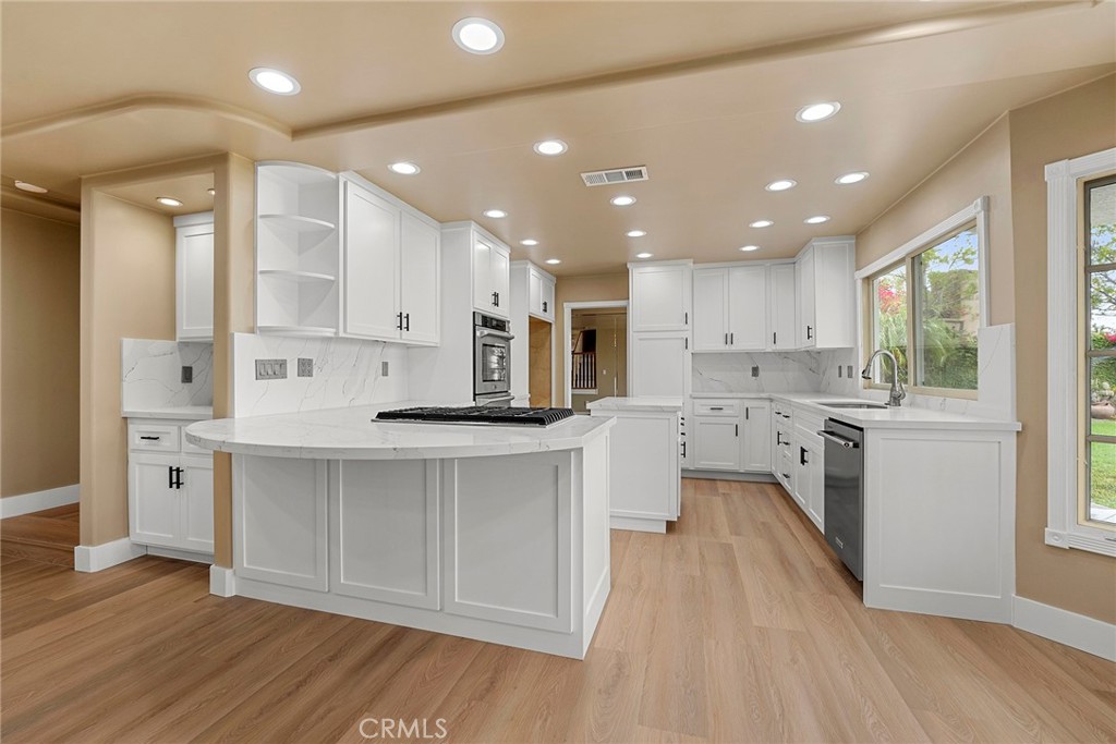 Huge price improvement!! Welcome to your Panoramic View home located in the Prestigious Rocky Point Community. This newly remodeled home is Beautiful! Gourmet kitchen with hardwood cabinets, upgraded stainless appliances, double oven, Quartz counters, breakfast bar and recessed lighting. Kitchen opens to oversized family room with gorgeous fireplace. Separate living room with elegant bay window. Large formal dining room. Spacious Primary suite with fireplace and private Viewing deck. Primary bath with custom shower, jacuzzi tub, dual sinks, quartz counters and large walk in closet with organizers. There are three other bedrooms with mirrored wardrobes and two other bathrooms that have been tastefully remodeled. Additional highlights include: Newer carpeting and plank style flooring, dual pane windows, recessed lighting, inside laundry, central vacuum, dual AC units, custom shutters throughout. Three car attached garage with storage. Located on a quiet cul-de-sac street. Spacious backyard with Breathtaking 180 Panoramic Views of Mountains and City lights.