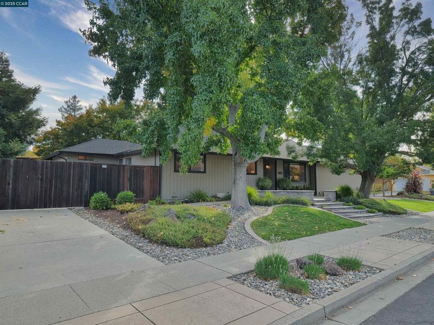 Beautiful, contemporary, entertainer’s delight located in Concord’s popular Colony Park neighborhood.  You will feel the pride of ownership in this home as you walk through the front door.  The sprawling floorplan offers a total of 1,659 square feet of living space, including 4 Bedrooms, 2 Bathrooms, and an Open Concept Kitchen / Dining Area / Family Room.  In addition, this home boasts a large Living Room, an updated Kitchen, updated Bathrooms, a Primary Bedroom addition, and an attached 2 stall garage with built-in storage and workshop.  Relax in the beautifully landscaped backyard with its private and tropical feel, and enjoy the low-maintenance decking, garden area, and RV / Boat parking area. This ranch style home is located on the border of Walnut Creek, very close to the Iron Horse Trail, 680, restaurants, and shopping.  Don’t miss this move-in ready opportunity and schedule a tour of this “Beauty” today!
