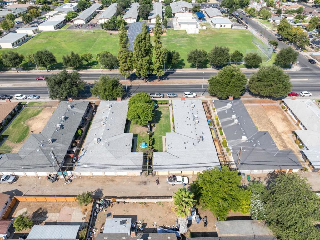 This 4-plex in Fresno's thriving Mayfair neighborhood has modern upgrades, strong cash flow, and excellent location in a high-demand rental market. All four spacious units are 100% leased with solid long-term tenants with upside potential in current rental market rates. This investment property is poised to deliver robust ROI for savvy investors. The property is on a huge lot with detached 4-car garages. In a good commuter-friendly location within walking distance of Manchester Centera dynamic retail hub with a movie theater and weekly farmers market. Fresno's rental market is red-hot, ranked the 9th most competitive nationwide with a mere 2.9% vacancy rate, tying for the 6th lowest in the U.S. Since 2019, fair market rents have skyrocketed 50%, averaging $1,285/month and peaking at $1,907/month for premium units.