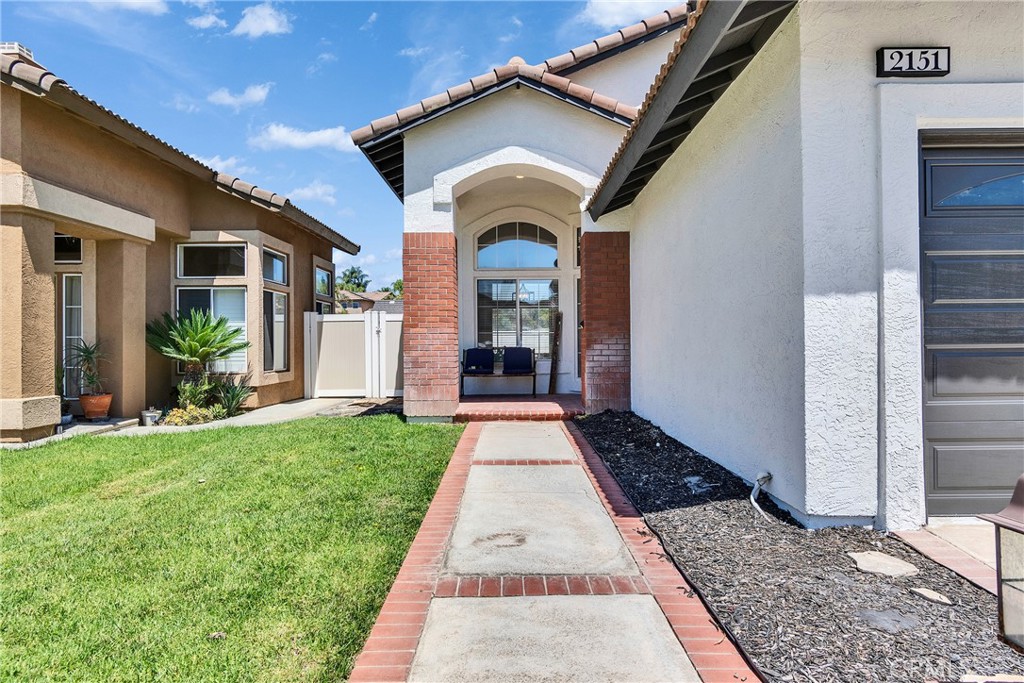 Location Location Location!! Easy access to the 15 fwy, 91, 60 located among rolling hills with views of the hills during the day and lights at night from the second story. Seller just put over $50,000 on upgrades. Grand two story entrance with a gorgeous staircase tile floors, wood like floors and new carpet. The kitchen and bathrooms a a gorgeous remodel with quartz counters, new sinks, new faucets, and the bathrooms have new tile floors. No neighbors behind! Super private backyard. This grand mini estate is appointed on a private cul-d-sac and a generous lot. award winning school district close to shopping and restraunts. Bed and full bath down