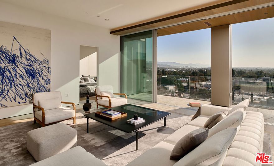 Introducing Residence 6D at 8899 Beverly, the last remaining residence in this popular 2 bed/2.5 bath corner floorplan. The southeast  location enjoys views of the Hollywood Hills, Griffith Observatory, and the snow-capped San Gabriel mountains. The custom designed chef's kitchen anchors two separate entertaining areas, each with private outdoor spaces. The layout allows for maximum interior design flexibility and jetliner views across the Hollywood Hills to the snowcapped San Gabriel mountains. The dual primary suites on opposite sides of the home each feature walk-in closets and en-suite baths. Dramatic Vitrosca sliding glass walls open wide, seamlessly connecting the interior living spaces with the private terraces.  From the handcrafted leather entry door handle to the gourmet chef's kitchen featuring premium Sub-Zero, Miele, and Gagganeau appliances, and the spa-inspired bathroom suites, nothing has been overlooked. 8899 Beverly Blvd is Olson Kundig's "Love Letter to Los Angeles". This Leed-certified property offers exceptional amenities and full service living with 24-hour concierge, 24-hour valet parking, and fitness center with private studio. Outside, a lushly landscaped quarter-acre oasis awaits with a resort-style pool, spa, fireplaces, and custom outdoor kitchen. Walk to premier dining and shopping destinations, grocery stores, and the best West Hollywood has to offer including the new Stella Restaurant located in the building opening in early 2024. Experience the epitome of luxury living in West Hollywood. Contact us for a private viewing today. Please note: Listing photos are from the 7th floor furnished model. Some interior features and views may vary slightly.