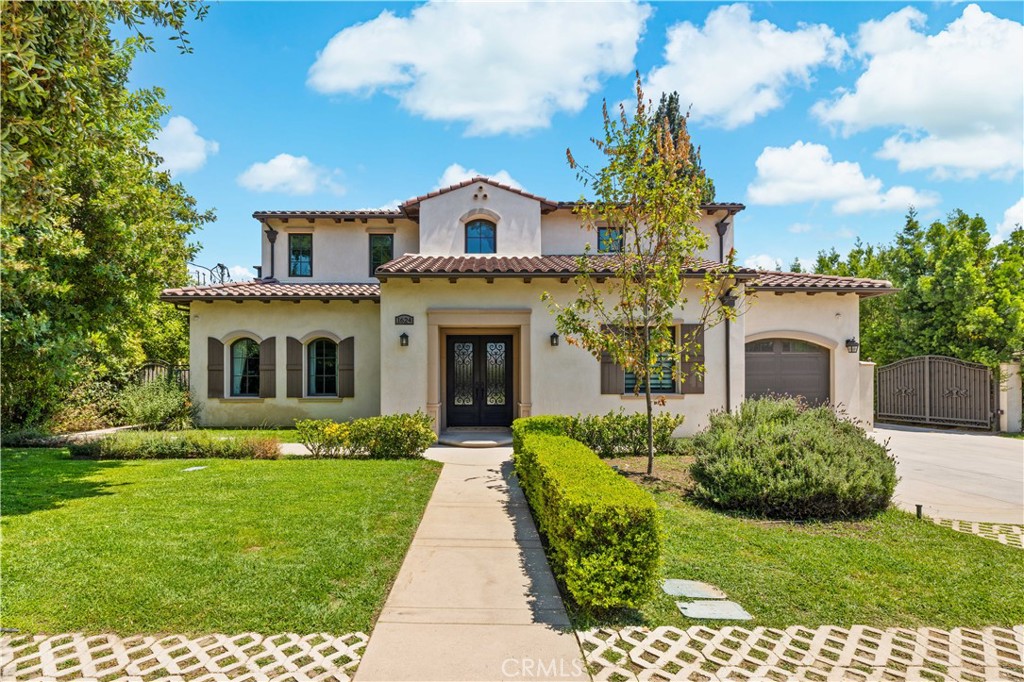 Completed in 2019, this magnificent residence is ideally situated on a serene, tree-lined street in one of Arcadia's most coveted locations. Boasting nearly 7,315 sqft of meticulously crafted living space on an expansive 15,000+ sqft lot, every detail of this custom estate exudes sophistication and comfort.
Step through the grand double-door entrance into a breathtaking marble foyer with soaring ceilings, dazzling crystal chandeliers, and elegant domes, setting the tone for the opulence within. An exquisite, built-in library offers a quiet sanctuary, while the glamorous living room, complete with a designer fireplace, flows seamlessly into the formal dining room – perfect for entertaining.
The gourmet kitchen is a chef's dream, featuring gleaming granite countertops, top-of-the-line stainless steel appliances (including a built-in refrigerator), a generous center island, breakfast nook, custom cabinetry, a dedicated pantry, wet bar, and even a separate wok kitchen.
This thoughtfully designed home offers 4 luxurious suite bedrooms and 1 guest room plus 2 additional baths, including a convenient main-level guest suite with a Jacuzzi bathtub and shower. The upper level features a spacious master suite, complete with double sinks, a soaking tub, and two massive walk-in closets.
The expansive open basement is an entertainer's paradise, featuring a state-of-the-art home theater with reclining chairs, a built-in projector, and a sound system, a dedicated gym room, a sophisticated wine cellar, and another wet bar.
Beyond the exquisite interiors, this estate offers practical luxuries including an intercom system, alarm, night security cameras, tankless water heaters, a sunroom, custom-built cabinetry, and a 3-car attached garage with automatic gate access. The professionally landscaped front and backyards provide a beautiful setting, with ample room for a future pool.
Enjoy the ultimate convenience with walking distance to elementary schools, shopping malls, restaurants, and supermarkets. This property is also located within the award-winning Arcadia School District. Don't miss the opportunity to own this Arcadia masterpiece. Schedule your private viewing today!