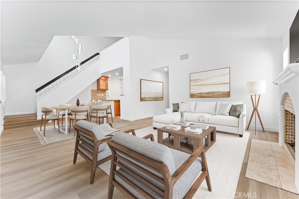 Experience elevated living in this beautifully upgraded 2-bedroom, 2-bathroom condo with a spacious top-floor loft—perfect as a third bedroom, office, or flex space. Privately situated within the community, this light-filled residence showcases soaring vaulted ceilings and expansive windows that bathe the open-concept layout in natural light. The inviting living room is centered around a cozy fireplace and features upgraded flooring throughout.
The expanded kitchen is a chef’s delight, featuring granite countertops, brand-new stainless steel appliances, a stylish backsplash, and an oversized sink. The serene primary suite offers a peaceful retreat, complete with a charming alcove and tranquil views of the lush greenbelt. Step out from the family room onto your private balcony, ideal for relaxing or entertaining while enjoying the verdant surroundings.
Additional highlights include a spacious two-car garage and access to resort-style community amenities, including a pool and spa. Ideally located near scenic parks, hiking trails, award-winning schools, premier dining, shopping, and entertainment—with effortless access to Orange County’s world-class beaches and luxury resorts.