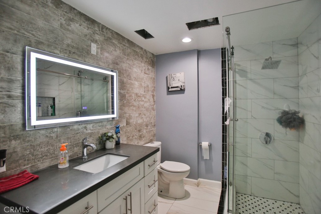 Exceptional Custom-Built Home — Distinctive Charm & Spacious Living!
Discover this beautifully crafted 1,919 sq. ft. residence offering 3+ bedrooms and 2 tastefully upgraded bathrooms, designed for comfort and functionality. Step inside to find stunning new engineered wood flooring throughout and a remodeled kitchen featuring sleek quartz countertops, brand-new cabinetry, and modern appliances—perfectly blending style and utility.
Enjoy a host of recent upgrades including dual-pane windows, copper plumbing, and fresh exterior paint. The roof is under 10 years old, and the home is equipped with two separate A/C units for personalized climate control. Additional blown-in insulation ensures enhanced energy efficiency year-round.
Sitting on a generous 8,218 sq. ft. lot, the property is brimming with possibilities. It features:
- Multiple sheds for versatile storage
- A large RV-sized garage-style building
- A spacious 2-car garage
- A dedicated workshop for hobbies or projects
This expansive lot may allow for a second home or an Accessory Dwelling Unit (ADU)—buyers are encouraged to verify potential land use with the City of Santa Ana.
Lovingly built and meticulously maintained, this one-of-a-kind home is ready to welcome its next fortunate owner. Located near churches, shopping centers, and vibrant Asian markets, it combines modern convenience with timeless charm.