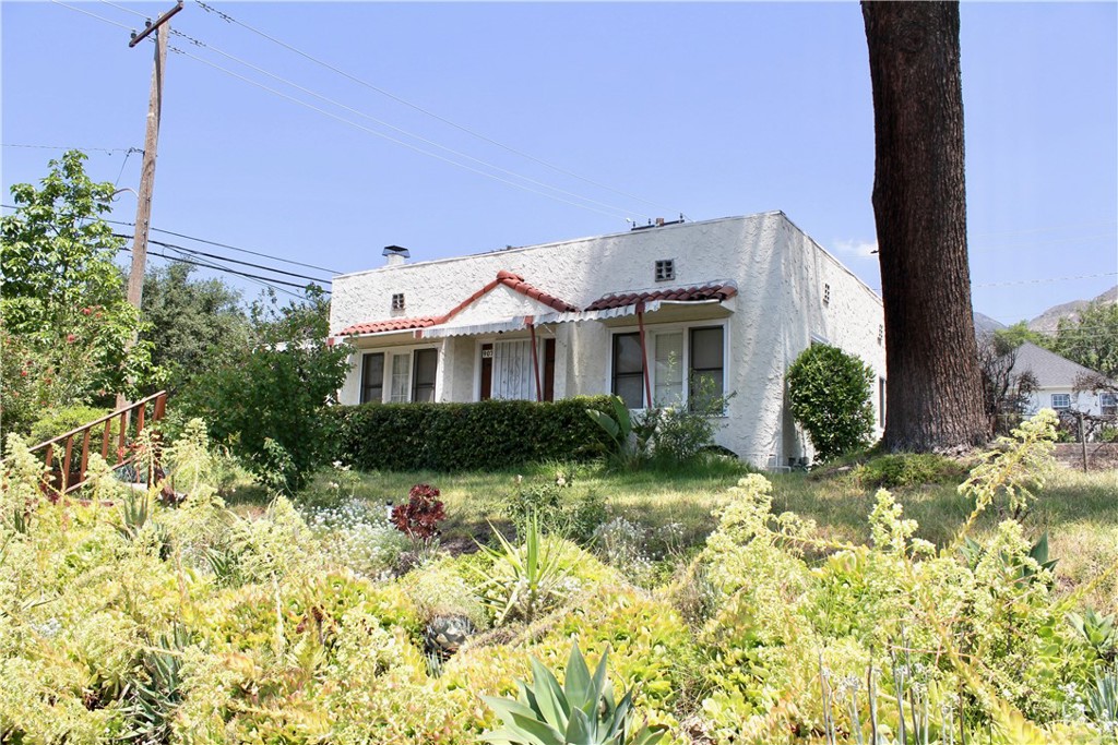 Own a piece of Altadena history. Charming 1924 Spanish Bungalow almost untouched by the fire. All necessary post fire remediation successfully completed by Restore All Enviro LLC (report is available) including new insulation in the attic. Zoned as a duplex, the back house (909 E Poppyfields) the carports and garages were lost in the fire and opens the door for potential build of a second house, ADU, or expansion of 907 E Poppyfields. Nestled within a cluster of unscathed homes untouched by the fire and reminiscent of neighborhoods before the fire destroyed so much of the area. Vintage charm and modern conveniences including central air and heat, cooks' kitchen with abundant cabinets and counter space, dishwasher, stove, washer and steam dryer, NEW tankless hot water heater, NEW solar ready electric panel, most windows double paned, custom closets, foundation bolted, gas insert in fireplace. turn key... Rare opportunity to buy into one of Altadena's most iconic NE neighborhoods as it rebuilds and renews.