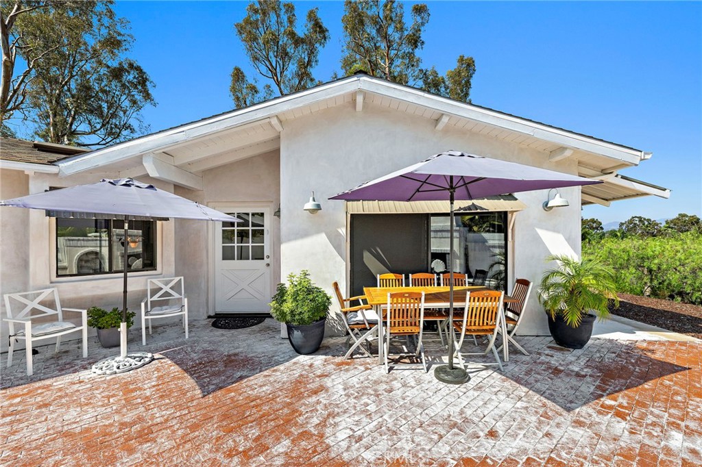 This distinctive 0.34-acre property offers an ideal blend of lifestyle and flexibility—perfect for those seeking a unique live/work setting. Nestled in a peaceful location with sweeping views of the valley and city lights, it’s also just a short walk to local shops and restaurants, and a quick bike ride to Doheny Beach.
Zoned within San Juan Capistrano’s Planning Sector A-1, the property supports a wide range of uses: general retail, business or medical offices, food and lodging, senior apartments, or a private residence. Conditional uses include a veterinary clinic or interior design studio, making it ideal for professionals, creatives, or entrepreneurs looking to live and work from one inspiring location.
The home itself features soaring exposed beam ceilings, a brand-new stovetop, updated bathroom fittings, and an outdoor shower. The exterior living space is equally inviting, with a tranquil fountain and a real wood-burning fireplace—perfect for quiet evenings or casual entertaining.
Private showings by appointment only. Please do not enter the lower gate or property without prior coordination.