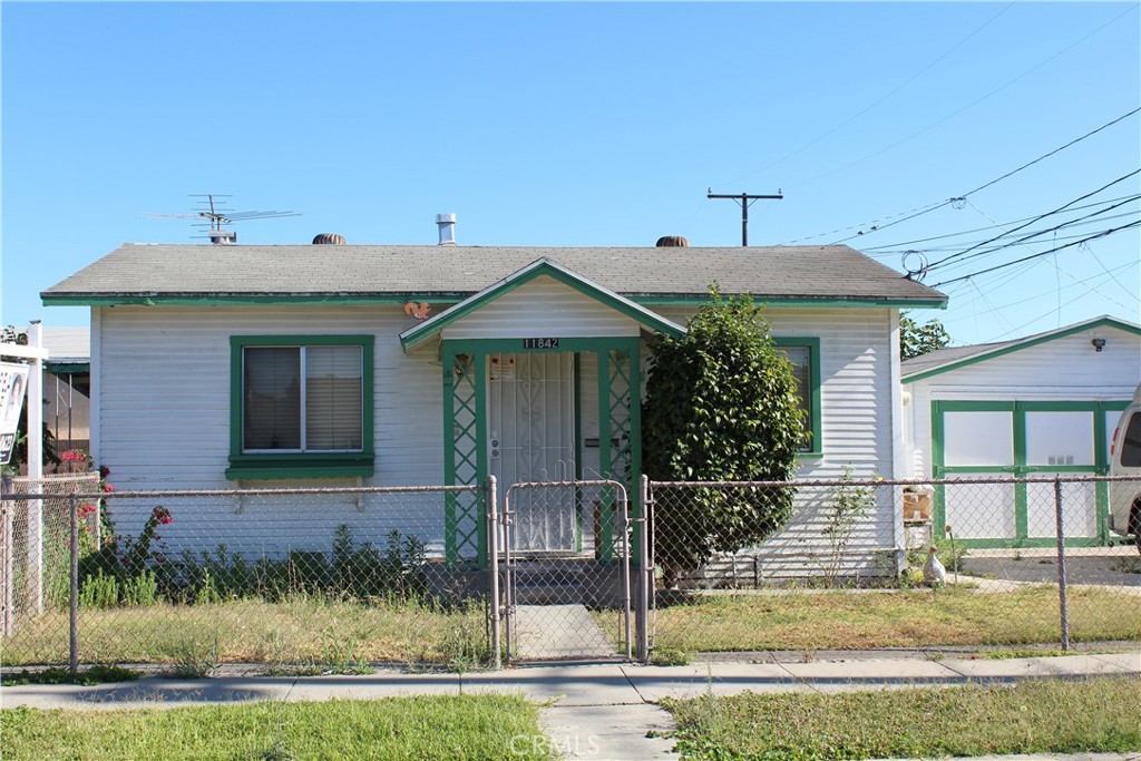 LOCATION ! LOCATION! LOCATION! This 2 bedroom home is BRIMMING WITH ADU POTENTIAL!!!!!! This home has been in the same family for over 75 years. This is the perfect canvas to make it your own. Large garage, Chain link fencing all around. Close to ALL conveniences, like public transportation, shopping, churches, schools, a 7 minute drive to Cerritos College. This property is centrally located to Freeways 5, 105, 91, and 605. Let's open escrow now!!!!