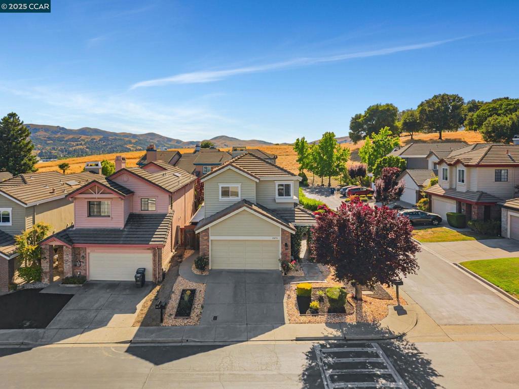 Beautifully updated 4BD/3BA home on a spacious corner lot in the desirable gated community of Canyon Lakes. A northeast-facing entrance and soaring ceilings create a bright, open, and inviting atmosphere. Recent upgrades include new flooring, fresh interior paint, and stylishly renovated bathrooms—including a stunning primary bath retreat. The kitchen features newer appliances and offers excellent functionality for everyday living and entertaining. A convenient main-level bedroom and full bath provide ideal flexibility for guests or multi-generational living. Major system improvements include a newer HVAC and water heater for added peace of mind. The expansive backyard—one of the largest in the neighborhood—is neatly landscaped with a variety of fruit trees: Mulberry, Grape, Apricot, Peach, Grapefruit, Lemon, Mandarin, and Orange, plus plenty of open space for relaxing or entertaining. Located near top-rated schools with an easy commute and just minutes from City Center and shops. Comfort, charm, and convenience—this a home you won’t want to miss!
