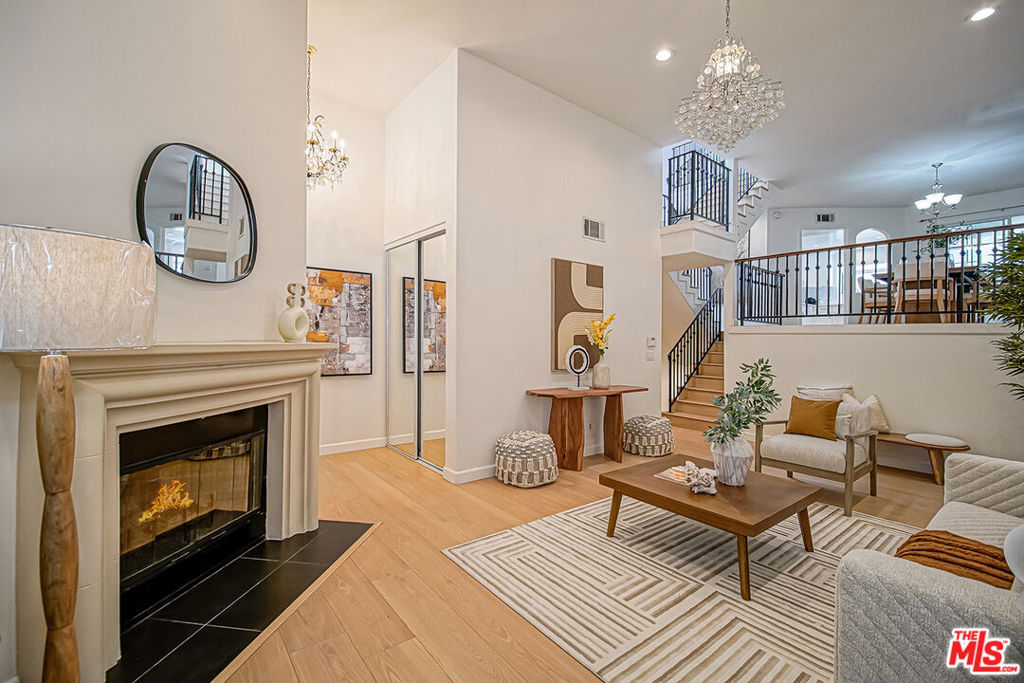 Bright, Open & Beautifully Remodeled Townhome!This spacious 3-bed, 2.5-bath residence showcases vaulted ceilings, skylights, fireplaces, arched windows, walk-in closets, and a large private patio. The remodeled kitchen features a new refrigerator, oven, and microwave, and opens to a versatile office/play area adjacent to an elevated formal dining room perfect for entertaining. Upstairs, all three bedrooms are generously sized and well-appointed, each with a walk-in closet, including a primary suite with fireplace, soaking tub, separate shower, and dual-sink vanity. Enjoy direct access to an oversized 2-car garage with laundry area and abundant storage. Ideally located just two blocks from award-winning Clover Avenue Elementary, easy access to Beverly Hills, Santa Monica, the 405 & 10 freeways, Expo Line, restaurants, shopping, and entertainment.