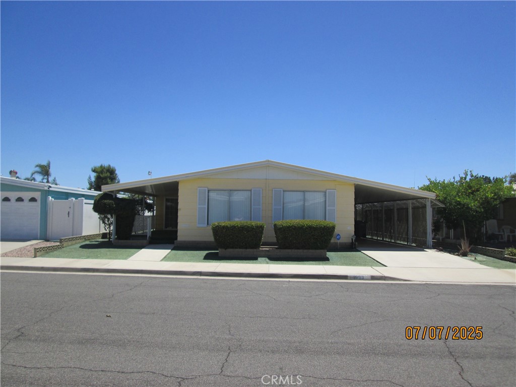 Why pay high space rent when you can own the land in this super clean triple wide manufactured home with 2 beds, 2 baths and an office or craft room, a carport, front porch, rear patio and 3 sheds (one being a workshop) in the desirable Sierra Dawn South, an age restricted community. In addition, the interior has been painted, kitchen counters replaced, new stove top and new S/S dishwasher, copper piping, toilets replaced, custom drapes, newer water heater, and new sliding glass door. Other features include: security screen doors, large primary bedroom, dining area, living room, family room, front porch with new indoor/outdoor flooring, a vacation mailbox and easy care landscaping. For convenience, the refrigerator and entertainment center are included. All this and a low tax base with special assessments of only $82.00.