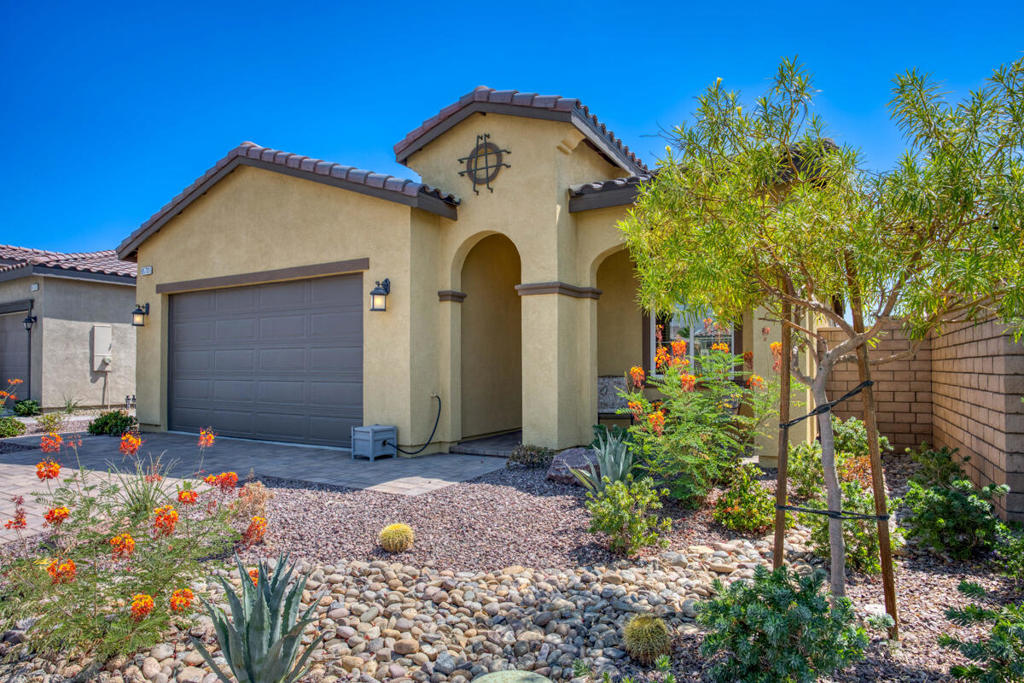 Freshly painted and move-in ready! This charming 2 bed, 2 bath single-story home is located in the highly desirable, gated Four Seasons at Terra Lago--a premier 55+ community. Exceptional curb appeal greets you with low-maintenance, drought-tolerant landscaping and an inviting covered front porch. Inside, enjoy high ceilings, recessed lighting, fresh paint, and a bright, open floor plan. The formal living room flows into the spacious great room, featuring a cozy fireplace, formal dining area, and a beautifully appointed kitchen with a center island, granite countertops, stainless steel appliances, and a walk-in pantry. Double sliding glass doors open to a private backyard with a covered patio, elegant pavers, and a manicured garden--perfect for entertaining. The thoughtfully designed split-bedroom layout offers privacy, placing the spacious primary suite--with a large walk-in closet and luxurious ensuite--on one side, and the guest bedroom and full hall bath on the other. A dedicated laundry room with extra storage and direct garage access adds convenience. Resort-style living awaits! Enjoy world-class amenities, including a clubhouse, fitness center, indoor/outdoor pools, spa, BBQ area, billiards, bocce, tennis, pickleball, and banquet facilities. Ideally located near golf, casinos, dining, shopping, and Palm Springs International Airport. Location. Lifestyle. Luxury. Welcome to Four Seasons at Terra Lago! Mortgage savings may be available for buyers of this listing.