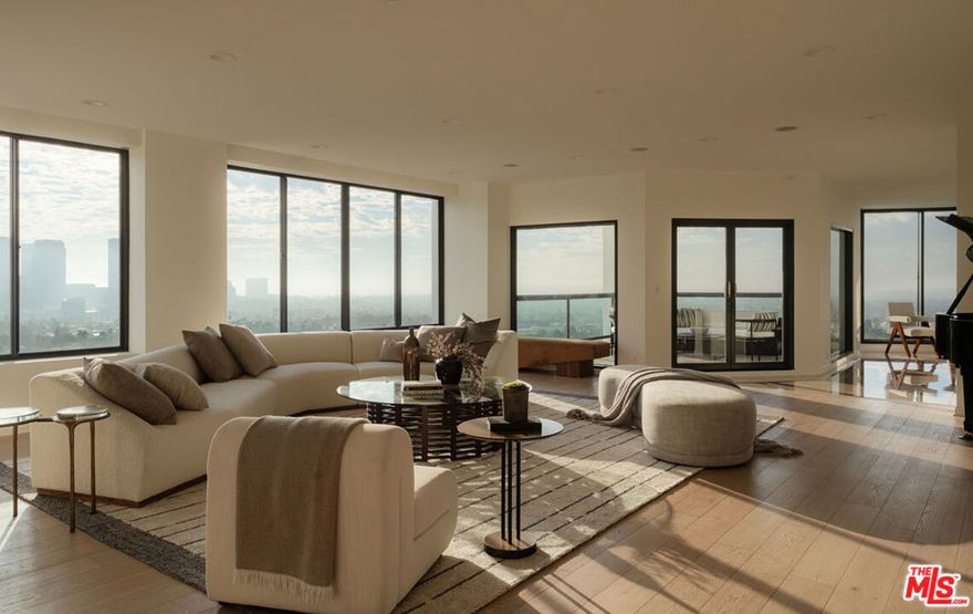 Welcome to the Penthouse at Park Wilshire - A rare opportunity to own one of Los Angeles' most significant high-rise residences. Encompassing over 6,600 square feet of living space, this remarkable Penthouse embodies the essence of refined luxury with 270-degree panoramic views from the ocean to the hills, enjoyed from four expansive terraces. An elegant paneled entry leads to grand living and dining areas flooded with natural light through walls of glass. Soaring ceilings, abundant wall space, and wide-plank white oak floors set an ideal backdrop for art and entertaining. The brand-new chef's kitchen features a Taj Mahal quartzite island and Miele appliances. The serene primary suite spans over 1,800 square feet, with dual glamorous baths, two walk-in closets, a private kitchenette, and a lounge opening to a terrace. A separate wing hosts the junior suite, guest bedroom, and an additional room currently serving as a home office. The media room provides the perfect retreat for film and music enthusiasts. The Park Wilshire's recent renovations offer some of the finest amenities on the Corridor; an elegant lobby, library lounges, pool/spa, and a modern, expansive fitness center. With views stretching from sunrise to sunset, this grand residence truly defines elevated Los Angeles full service living. Don't miss out on the opportunity to own this rare offering, located just minutes from Beverly Hills, Hillcrest Country Club, LACC, Bel Air Country Club, Westwood Village and more.