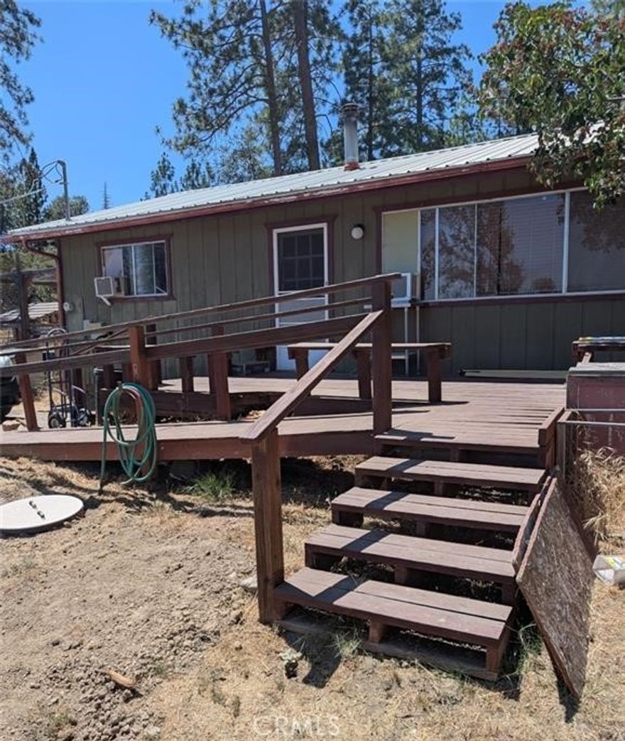 Well maintained 2br 1 BA home in Lush Meadows community. Enjoy the mountain life with wildlife, private lake, and privacy. Home has a new metal roof(3 years), wood stove, new kitchen cabinets and countertops, completely remodeled bathroom, bamboo flooring in kitchen, kitchen, main bedroom, bath and deck painted in last year, and a semi attached insulated garage that can be used as a she-shed, mancave, or storage. Power outage?? No problem! Just fire up the generator and you're back in business. There is a storage shed and a covered area for your firewood. Priced to sell in one of Mariposa's most sought after communities. HOA fee only $150 a year! Call to view today before it's gone. Seller motivated!