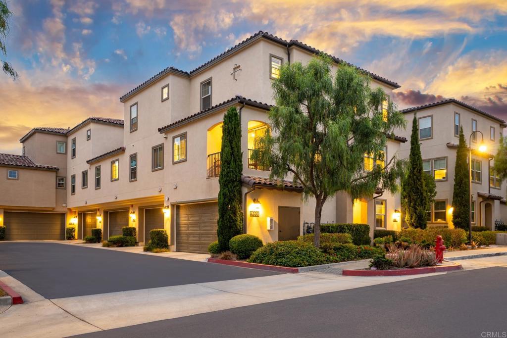 Welcome to 4336 Harbor Way Unit 1, a stunning corner-unit townhome offering luxury coastal living in the highly desirable Saint Cloud community of Oceanside. This upgraded 3-bedroom, 3.5-bathroom residence features one of the most sought-after floor plans in the neighborhood, blending modern style, smart technology, and everyday comfort. The entry level includes a private bedroom with an ensuite bath—perfect for guests, multigenerational living, or a home office setup. Upstairs, an open-concept second floor showcases an open kitchen with white quartz countertops, rich cabinetry and stainless steel appliances—including an LG SMART refrigerator. The kitchen flows seamlessly into spacious dining and living areas, highlighted by high ceilings, recessed lighting, ceiling fans, and large dual-pane windows that fill the home with natural light. Enjoy your private balcony with coastal breezes and sunset views—ideal for evening relaxation. Each bedroom is an ensuite, including the luxurious primary suite with a custom walk-in closet featuring modular technology system. Additional upgrades include luxury vinyl plank and tile flooring throughout, LG ThinQ washer and dryer, and a high-efficiency Navien tankless water heater. The finished 2-car attached garage features heavy-duty overhead storage racks for added convenience. As a Saint Cloud resident, you’ll enjoy access to resort-style amenities: Expansive swimming pool & spa Clubhouse available for private events State-of-the-art fitness center, BBQ areas, playground & half basketball court. Located just 5 miles from the iconic Oceanside Pier, and minutes from local shopping, dining, parks, major freeways, Frontwave Arena, and award-winning schools. Experience the best of Southern California coastal living!