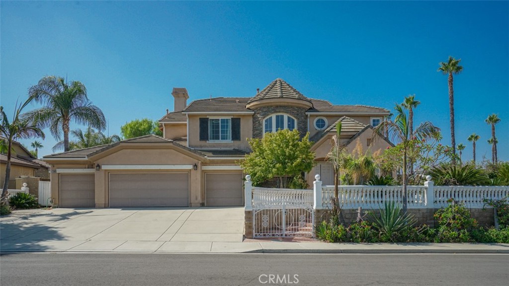 Located in the prestigious gated community of Victoria Grove, get ready for the home you’ve been dreaming about! From the minute you walk in the front door, you can feel the elegance surround you. Awe inspiring two story ceilings with a magnificent turret foyer leading to a catwalk to greet your guests. Open floor plan within, including a space for formal living another for formal dining. The kitchen opens up to a very large great room so the chef of the home will not be left out of the family gatherings. The kitchen itself is complete with granite slab counters, a large center island, hammered copper sink, a large 5 burner stand alone cooktop, and walk in pantry. Bedrooms in the home are large and the bathrooms are custom. The Master bedroom with its double door entry, dual walk in closets and custom bathroom create a private retreat! Home has a large pool size lot with many mature tropical fruit trees. Plenty of parking and storage with a large 4 car garage and an indoor laundry room. Amenities include 2 parks, open sports field, baseball diamond, basketball court, pool/spa and patrolling security guards. Close to the local farmers markets and the distinguished Lake Mathews Elementary school.