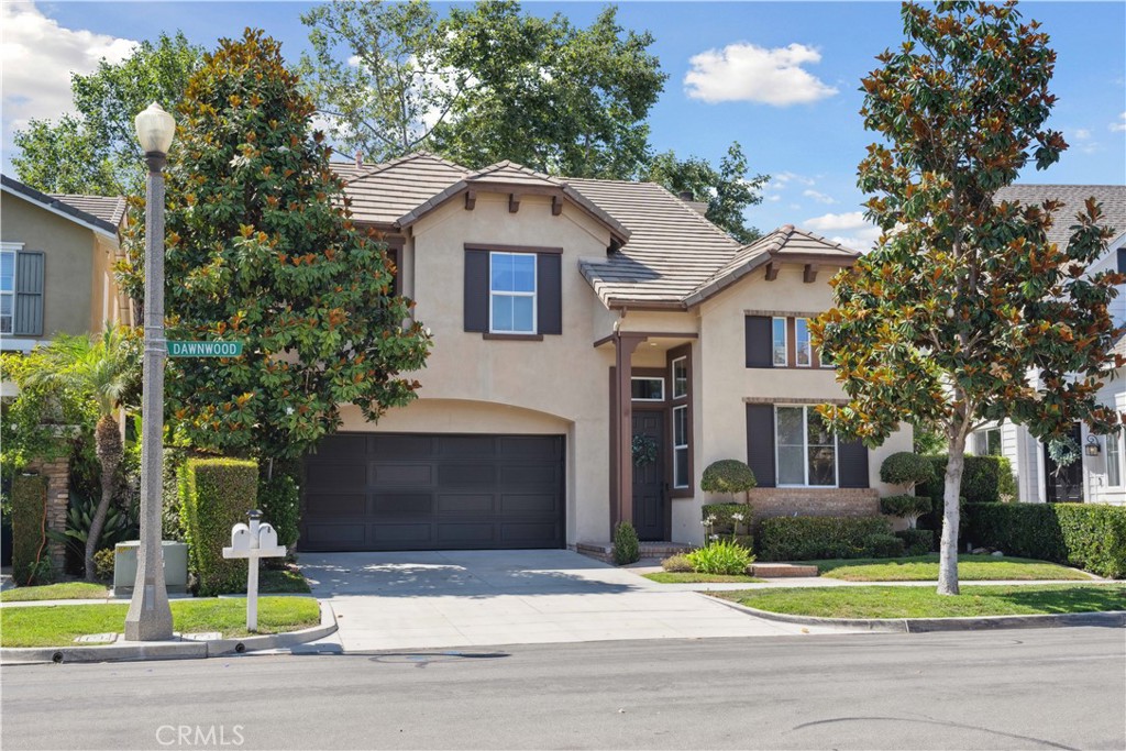 Discover the charm of 21 Dawnwood in the highly desirable Oak Knoll Village neighborhood of Ladera Ranch. This beautifully renovated 4-bedroom, 3-bathroom gem is a perfect blend of comfort and modern elegance. The open-concept layout welcomes you with bright natural light and seamless flow. The recently updated modern kitchen—featuring custom cabinets, stainless steel appliances, sleek backsplash, and quartz countertops—opens directly to the family room, making it perfect for everyday living and entertaining. Brand-new floors throughout enhance both style and functionality. Downstairs, a versatile bedroom equipped with a built-in Murphy bed and a full bath is ideal for guests or a home office. Upstairs, you'll find three more spacious bedrooms, a laundry room, a built-in desk area perfect for homework or remote work. Step outside to your private balcony—ideal for sipping morning coffee or taking in the surrounding beauty. Retreat to the outside where you can enjoy both a private side patio and a separate backyard with sweeping mountain views—perfect for summer barbecues or serene relaxation. With a park just steps away and the neighborhood pool within walking distance, this turnkey home blends comfort and convenience flawlessly. This home has easy access to Ladera Ranch's exceptional amenities, including award-winning schools, scenic walking trails, picnic areas, shopping, dining, and more. Don’t miss the opportunity to make this move-in ready home yours. Come grab this gem before its gone.