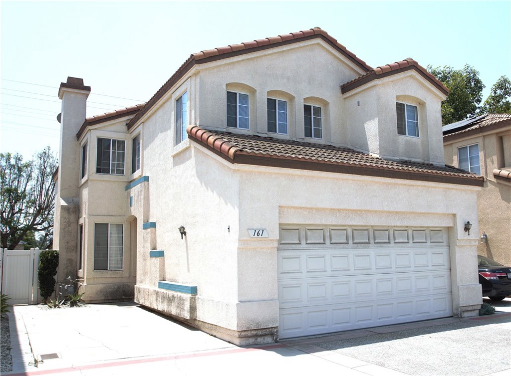 Spacious 4 bedrooms 2.5 baths single family home in a gated community. Smaller complex with 41 units only. Two level home with tiled entry way and tiled large living room and a formal dining area. Cozy fireplace in the living room. Freshly painted interior. Good size family room that opens into the backyard. Very bright and airy home with lots of windows. Tiled kitchen counter tops and tiled floors. Kitchen cabinets have been painted. Older appliances. All 4 bedrooms are on the upper level. Master bedroom with double door entry. It features a walkin closet and an attached large master bathroom with tiled floors. Dual sink, a large bath tub and a shower. The staircase and the upper level is all carpeted. The other 3 bedrooms are pretty spacious with large closets. Two of the bedrooms have mirrored closet doors. Separate laundry room with laundry hookups and a sink. The full bath has double sinks, carpet in the bathroom., large wall to wall mirror and tiled floors. The hallway upstairs have additional cabinets for storage. Extra features includes Skylights and high ceilings. The backyard is small and cozy to enjoy the evenings during summer. There is a half guest bathroom at the lower level. Two car attached garage with direct access to home. The forced air unit and the water heater are in the garage.