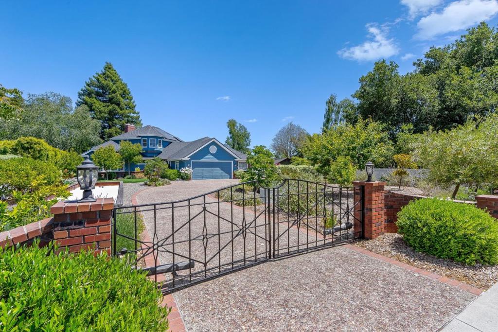 Properties like this don't come up often, especially one that combines a mostly usable lot with expansive ocean & city views. Tucked away from the street, this property offers privacy, mature landscaping, a white sand bocce ball court, & standout curb appeal. Extensively remodeled throughout with a newer roof & solar. The interior features hardwood floors, large picture windows that flood the home with light, & an open-concept living, dining, & kitchen area. The chefs kitchen boasts waterfall Carrera marble countertops & generous space for entertaining. The main level includes two bedrooms, one with an ocean view deck. Upstairs, the private primary suite is a true retreat with sweeping ocean vistas, its own balcony, a spacious walk-in closet, & a luxurious bath featuring quartzite counters, a walk-in shower, & a soaking tub perfectly positioned to take in the views. A large finished basement with a full bath offers flexible use as a home gym (complete with sauna), office, or media/game room. The backyard is an entertainers dream, complete with multiple lounge areas, a swimming pool & hot tub, fire pit, & an outdoor BBQ. All this just steps from Westlake Pond Park, Westlake School, UCSC, & the scenic Pogonip hiking & biking trails plus easy access to downtown & the beach.