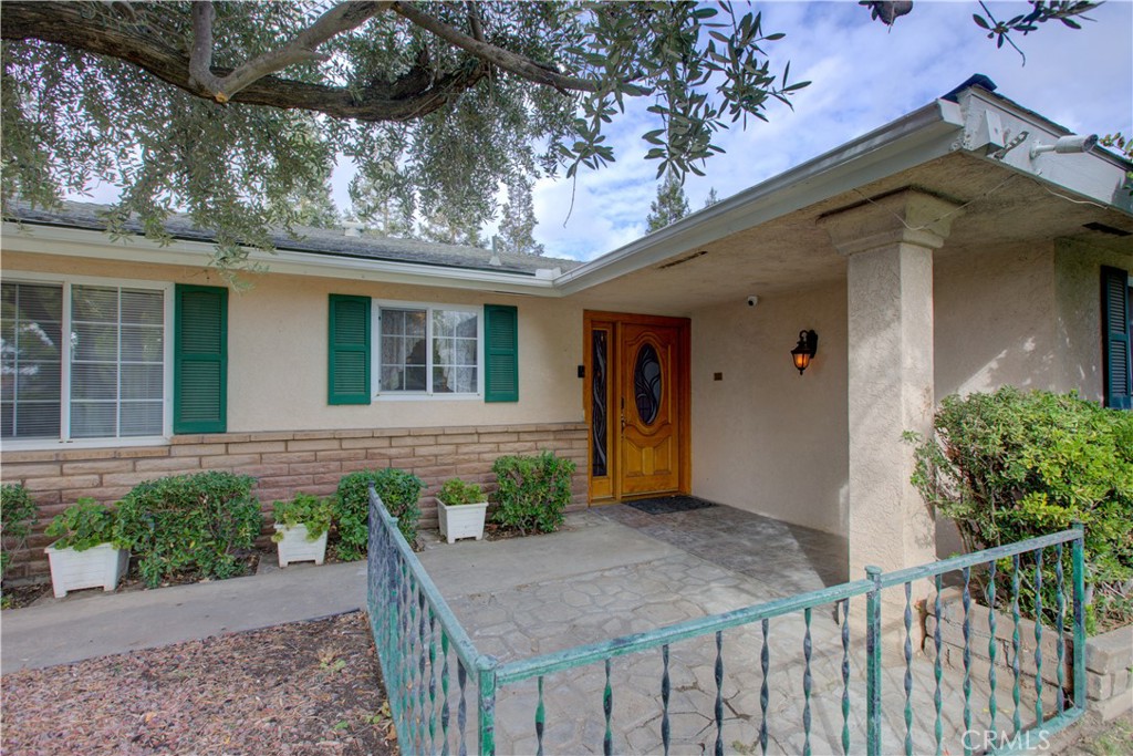 This 4-bedroom, 2-bath home offers 2,473 sq. ft. of living space on a 13,416 sq. ft. lot and is ready for your personal touch. Built in 1974, it features a formal living room and a spacious family room with a brick fireplace and built-in bookcases. The kitchen includes tile counters and floors, a built-in oven, electric cooktop, microwave, dishwasher, disposal, and a breakfast nook with a wet bar. The enclosed patio with ceiling fans opens to a large backyard with a sparkling pool—perfect for entertaining! The garage has been converted into a generous game room with an indoor spa and laundry area. The primary bedroom includes a walk-in closet, private bath, and access to the backyard. Additional highlights include ceiling fans throughout, plenty of storage, and possible RV parking or space for a tool shed. Don’t miss this great value and opportunity to make it your own!