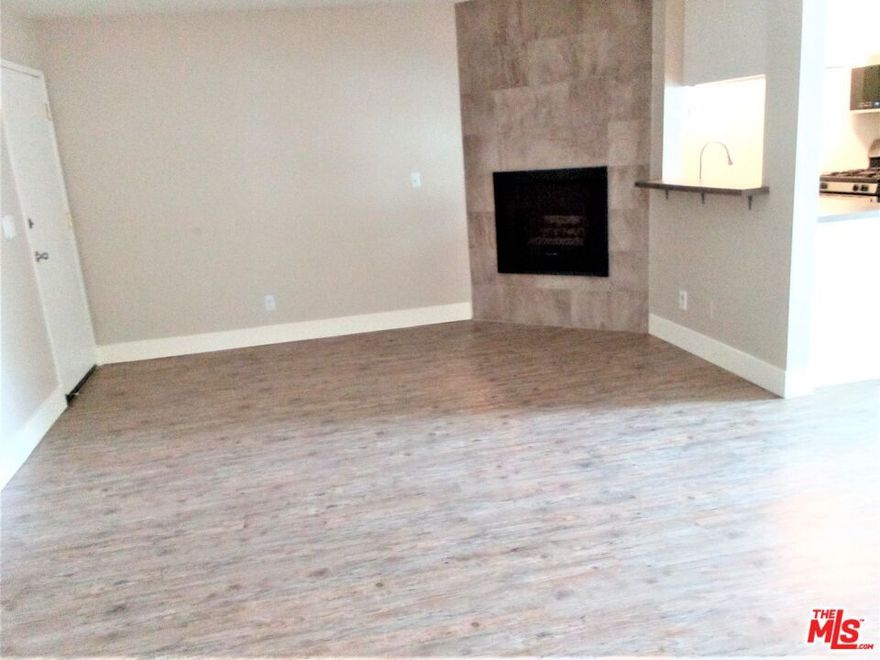 The spacious living room offers a fireplace and a balcony. The laminate floor is throughout the unit. The double-pane windows and central AC. Two assigned parking spaces. Picnic area with BBQ pits. Close to the NoHo art district and shops.