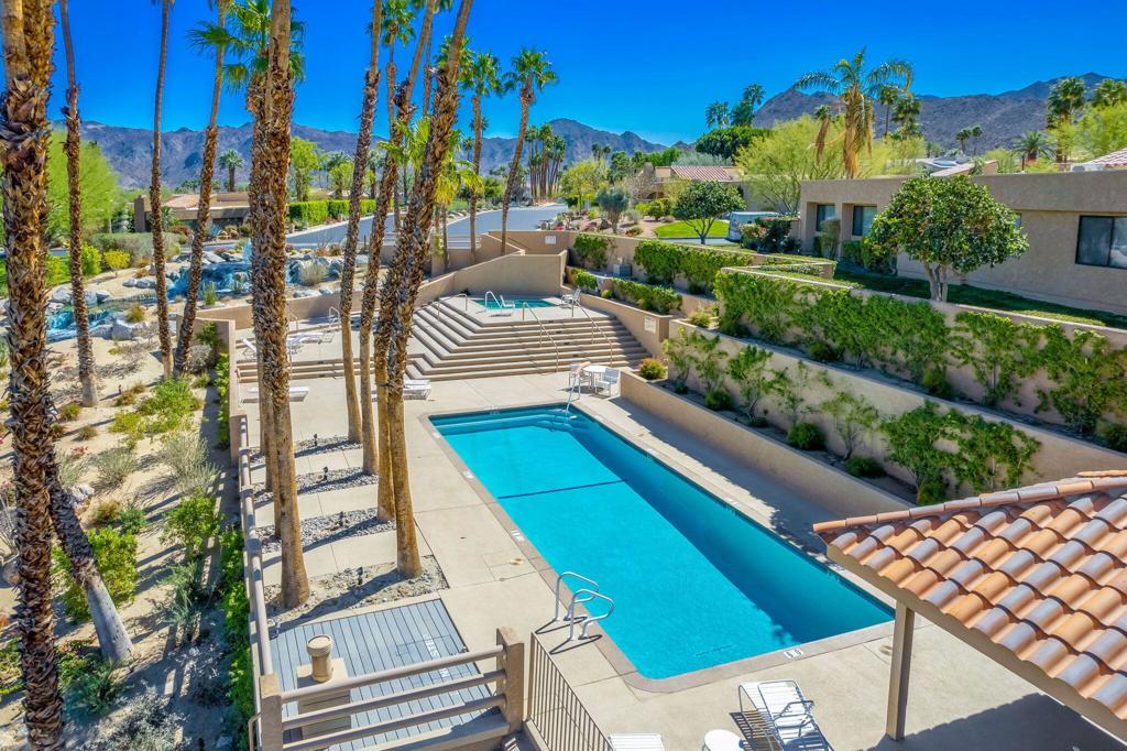 Tucked inside the sought-after gates of Ironwood Country Club in South Palm Desert, this updated condo is the perfect mix of modern style and relaxed desert charm--with absolutely stunning views of the Santa Rosa Mountains and the rare bonus of 7-day minimum short-term rental eligibility.From the moment you step through the custom iron and glass front door, you're welcomed into a private courtyard that feels like your own little resort--ideal for soaking in the jacuzzi after a hike or enjoying a glass of wine as the sun sets behind the mountains.Inside, the open-concept layout is bright, airy, and built for both quiet mornings and easy entertaining. Vaulted ceilings add volume, while the updated kitchen--with sleek black granite counters and stainless appliances--makes hosting or everyday living a breeze. The home has been tastefully refreshed, and still offers a chance to add a few personal touches to make it completely your own.Upstairs, you'll find two private suites--each with its own full bath and outdoor space. The larger suite includes a walk-in shower, dual sinks, generous closet space, and access to a private rooftop patio with killer mountain views. The second suite is just as charming, with built-in closet features and its own peaceful balcony.An oversized two-car garage with epoxy floors, front door auto solar shade, and close proximity to the community pool, tennis, pickleball, bocce ball, and fitness center round out the lifestyle.As an Ironwood resident, you'll enjoy 24-hour guard-gated security and optional club membership offering two championship golf courses, tennis, wellness facilities, dining, and a full social calendar. Plus, you're just minutes from El Paseo, The Living Desert, and the McCallum Theatre.Whether you're looking for a place to unwind, entertain, or invest--this one checks all the boxes. Come see it for yourself.