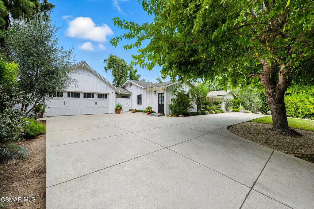 Welcome to this beautifully updated modern farmhouse-style home featuring 5 bedrooms, 4 bathrooms, plus a dedicated office/studio -- all within 3,155 sq ft of spacious living in the heart of Tarzana. Behind a private gate with a circular driveway, this property combines timeless charm with modern comfort.The light-filled interior showcases its farmhouse character with vaulted, beamed ceilings, wide-plank wood floors, and designer lighting. The open-concept layout offers multiple living and dining areas perfect for entertaining. The kitchen flows seamlessly into the family room and dining space, all overlooking the backyard retreat.The home offers five bedrooms, including a generous primary suite and a versatile additional room that can easily serve as a private office, art studio, or creative space -- perfect for working from home or pursuing hobbies.Step outside to your own resort-style paradise with a sparkling pool, relaxing spa, and outdoor firepit -- ideal for gatherings under the stars. The expansive yard offers plenty of space to play, lounge, and enjoy the serene setting.Additional highlights include ample storage, a layout perfect for families or those working remotely, and included gardener and pool service for easy maintenance -- simply move in and enjoy.Located in a desirable neighborhood, this home is a rare lease opportunity that blends privacy, luxury, and convenience -- all in the heart of Tarzana. Unfurnished or partially furnished option available.