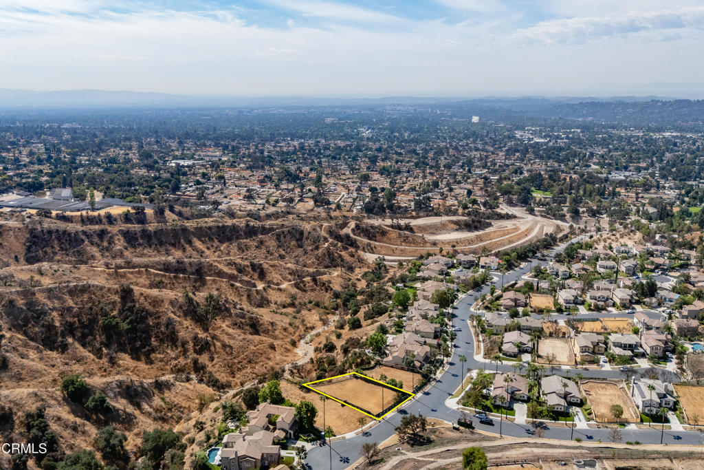 Incredible mountain, canyon and city views can be yours in the gated community of La Vina! Set against the foothills of the San Gabriel Mountains, this approximately 21,382 sqft lot was razed by the Eaton Fire. Prior to the fire, there was a 4 bedroom, 3 bathroom, and approximately 3,665 sqft single family home on the property. Prior home had gas, water, electric and sewer connection, but the current condition of those utilities is unknown. The community of La Vina has a guard at the front gate, a children's park and pool. Just outside the gates is the recently revamped Loma Alta Park with its playgrounds, tennis courts and picnic areas. Lincoln Avenue features Super King Market, West Altadena Wine Shop, HomeState restaurant and so much more. Buyers are advised to independently verify all aspects of the property with the County of Los Angeles and appropriate government agencies, including, but not limited to, lot remediation, future use of the property, rebuilding and permitting requirements, zoning and lot size. Buyers are advised to consult with the La Vina Homeowners Association about community rebuilding guidelines. Property is being sold in as-is condition without warranties or guarantees of future use. Do not walk on the property without an appointment.