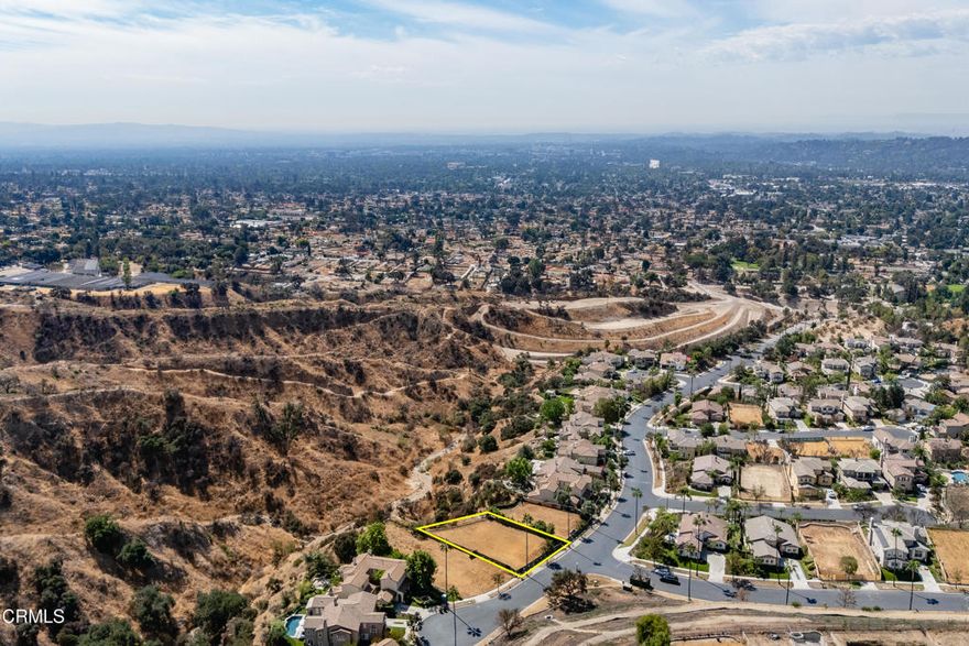 Incredible mountain, canyon and city views can be yours in the gated community of La Vina! Set against the foothills of the San Gabriel Mountains, this approximately 21,382 sqft lot was razed by the Eaton Fire. Prior to the fire, there was a 4 bedroom, 3 bathroom, and approximately 3,665 sqft single family home on the property. Prior home had gas, water, electric and sewer connection, but the current condition of those utilities is unknown. The community of La Vina has a guard at the front gate, a children's park and pool. Just outside the gates is the recently revamped Loma Alta Park with its playgrounds, tennis courts and picnic areas. Lincoln Avenue features Super King Market, West Altadena Wine Shop, HomeState restaurant and so much more. Buyers are advised to independently verify all aspects of the property with the County of Los Angeles and appropriate government agencies, including, but not limited to, lot remediation, future use of the property, rebuilding and permitting requirements, zoning and lot size. Buyers are advised to consult with the La Vina Homeowners Association about community rebuilding guidelines. Property is being sold in as-is condition without warranties or guarantees of future use. Do not walk on the property without an appointment.