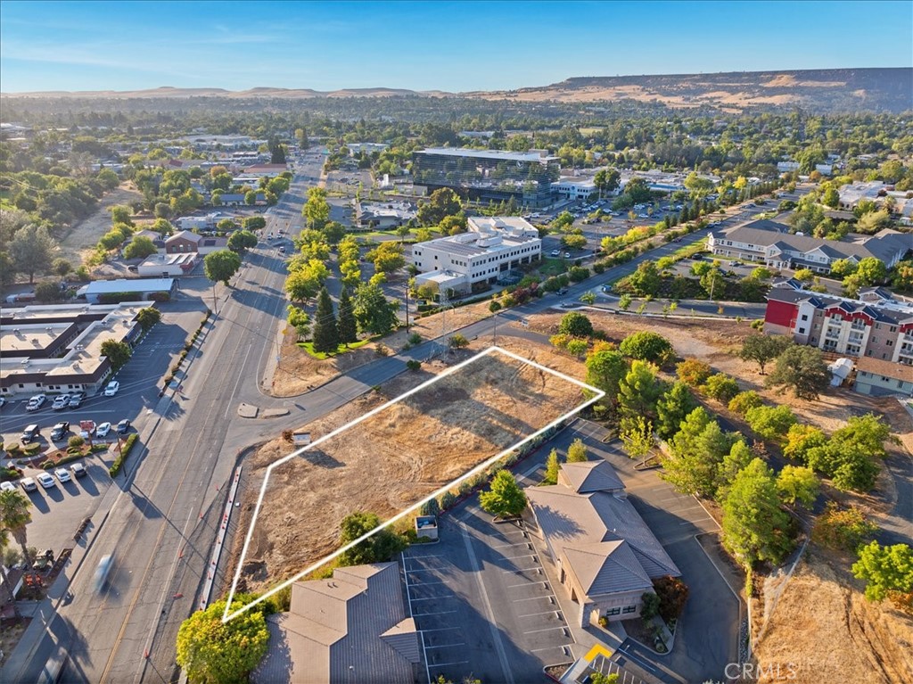 Prime Commercial Vacant Land on Olive Highway!! This 0.64-acre commercial lot is located on the highly trafficked Olive Highway, surrounded by well-established businesses, including Shakey's Pizza, Mike Grande Burger, Big O Tires, Golden Valley Bank, Carl’s Jr., Oroville Hospital, Taco Bell, and numerous office buildings. Positioned on a prominent corner lot, this property benefits from thousands of vehicles passing by daily, offering excellent visibility and easy access from Olive Highway and Executive Way. Olive Highway is currently undergoing an expansion to include four lanes, curbs, and gutters, enhancing accessibility and increasing the potential for future business development. Whether you're looking to develop retail space, offices, or a restaurant, this property offers the perfect opportunity to capitalize on the traffic and visibility of a prime commercial area. Don't miss this chance to invest in a growing commercial hub with solid potential for success!