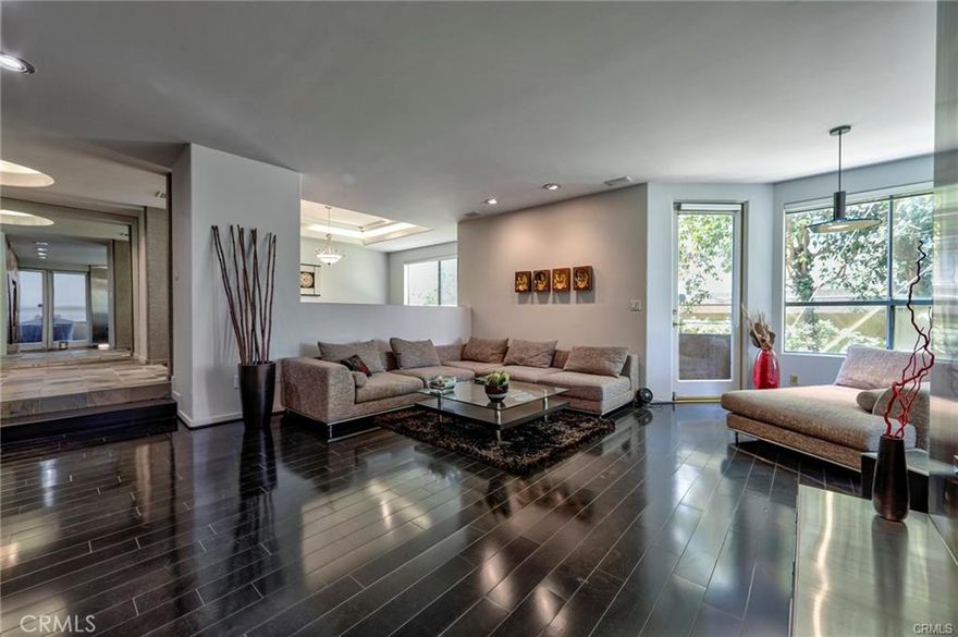 A luxurious, stately condominium in a high-end residential neighborhood boasting designer’s flaire. A rare, super spacious 2015 sq.ft. condo tucked all the way in the back w/ soothing views of greenery & trees. As you enter through the double-door entry, your eyes land on a dramatic Living room w/ 10' high ceiling, custom built fireplace, 2 balconies and a 20 ft. custom designed entertainment center. There's an elegant Formal Dining Room that can seat over a dozen guests – perfect of entertaining or family gatherings, accented by tray-ceiling w/ subtle lighting. Cooks’ kitchen with high-end appliances, Caesar-stone counters, opens to a breakfast area. We have 2 spacious en-suite bedrooms. The primary bedroom has a stylish custom-designed fireplace, 2 large walk-in closets, artistically designed paint, a private terrace and a sumptuous en-suite bathroom with soaking tub & shower, double sinks and make-up station. Amenities include: POOL, Gym, a Club- House, private storage unit, Side-by-Side parking, 8 guests parking spaces. HOA is $500 a month covers POOL, GYM, elevator, gorgeous courtyard's landscaping. There's $200 Earth Quake insurance. Location is unparalleled: a quick ride to Beverly Hills via. Coldwater Cyn. or hop on Hollywood Fwy just a few blocks away. For evening walks: enjoy this residential neighborhood's amazing properties or stroll to the new Sportsmen's Lodge's restaurants & shops. OWNERS OFFER INCREDIBLE INCENTIVES - Call me for info!
