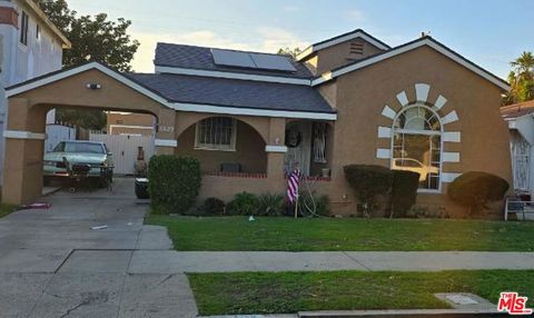 Photo of 8629 Cimarron Street, Los Angeles, CA 90047 (MLS # 25631219)