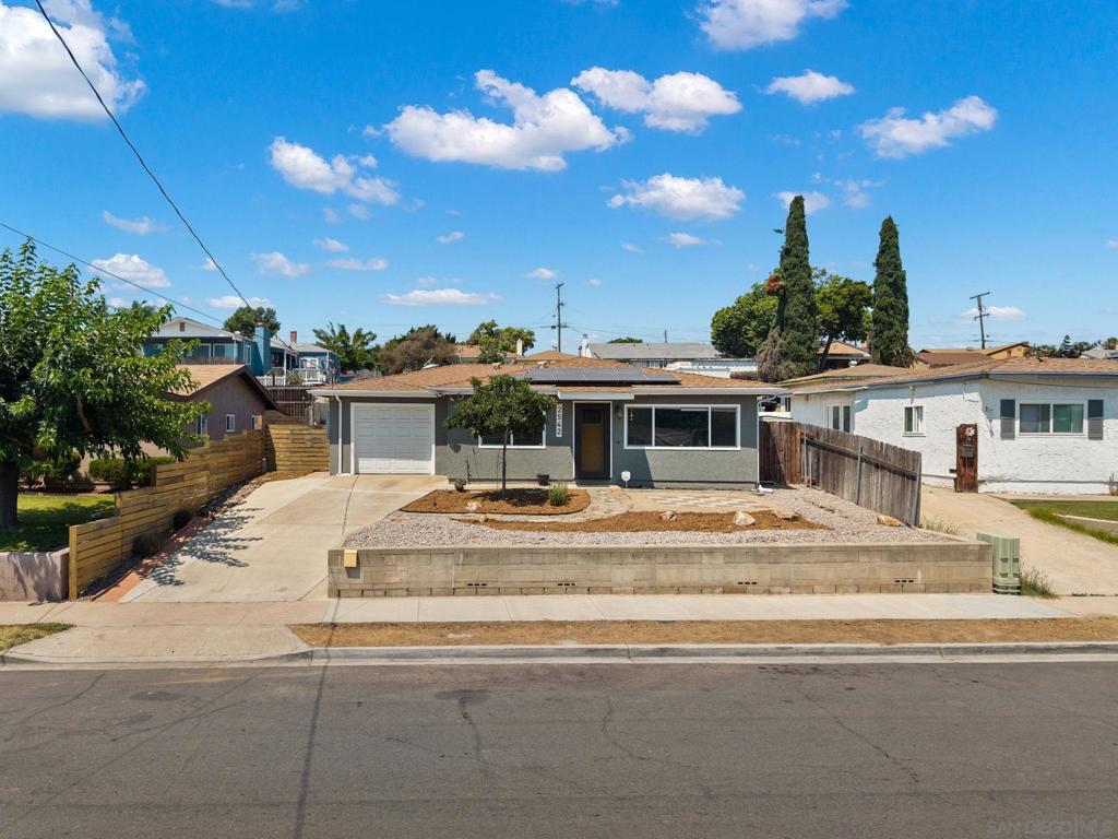 This beautifully updated 2-bedroom, single-family home is located in the heart of Lemon Grove. With an attached 1-car garage that has an EV charger outlet and an oversized driveway, this property offers both functionality and standout curb appeal. Step inside to a spacious, light-filled living room anchored by a large picture window that invites in beautiful natural light. Comfort meets efficiency with ductless mini-split systems in the living room and main bedroom, ensuring customizable climate control all year round with little expense due to the Solar Panels.(see supl) The kitchen is equally impressive, featuring modern laminate flooring, new stainless steel appliances, and open views of the dining area. The updated bathroom features contemporary finishes that complement the home’s overall modern feel. The generous backyard serves as a blank canvas with incredible potential—perfect for creating your dream outdoor space or adding an Accessory Dwelling Unit (ADU) for rental income or multigenerational living. The front yard is attractively landscaped, giving the home standout curb appeal from the moment you arrive. Situated just minutes from downtown Lemon Grove and centrally located between the 125 and 94 freeways, offers easy access to nearby shopping, dining, parks, and schools. With Downtown San Diego only about 15 minutes away, this location offers suburban charm with urban convenience. Whether you're a first-time homebuyer, looking to downsize, or exploring long-term investment opportunities, this move-in-ready home delivers comfort, space, and potential in one of San Diego’s most accessible neighborhoods.