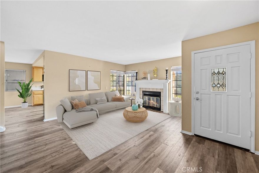 Adorable Pool Home with a huge flat backyard with 3 bedrooms, 2 1/2 baths, loft, living room with fireplace, & almost 1700 square feet across the street from the lake. Cozy living room featuring a wood-burning fireplace with mantel, open kitchen with newly painted white cabinets, stainless steel fridge & dishwasher, & bay window overlooking front yard, kitchen opens up to the dining area with a brand new slider that leads out to the patio and the big backyard & pool. Downstairs also features 1/2 bath that offers a door leading out to the backyard. Newer wood flooring covers the entire main level. Upstairs you'll find a loft with a fireplace that is the perfect family room, TV Room, or office with built-ins. Good-sized primary bedroom with an attached bath with dual sinks & separate room with shower/commode. 2 additional bedrooms; 1 bedroom with built-in desk, and the other with view of the pool. Additional bath upstairs. 2 car attached garage with laundry & storage (Separate room in the garage that can be removed if desired). Driveway offers boat/trailer parking. Private backyard features a fully fenced sparkling pool with BRAND NEW pump. Beautifully landscaped backyard and front yard with fruit trees. BRAND NEW HVAC system. Located on a great quiet street that is across from the lake. Canyon Lake is an exclusive gated and 24-hour guarded community & includes a private lake for boating, skiing, swimming, wake boarding, fishing, paddle boarding, canoeing, + 6-lighted tennis courts, Olympic size pool, beaches, parks, pickleball and basketball courts, club house, senior center, and clubs plus the community offers an 18-hole golf course golf & riding stables. Rent includes gardener and pool maintenance. Available now.