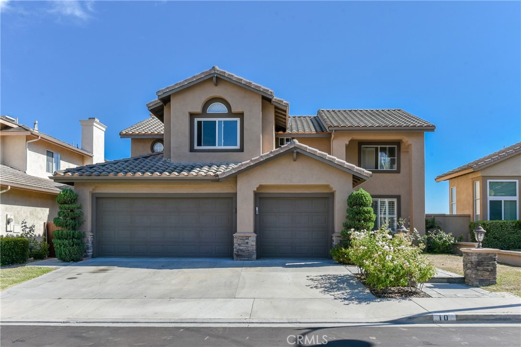 SPECTACULAR VIEWs of CATALINA ISLAND, Ocean, City Lights, & Hills in the charming hillside community of Foothill Ranch. Fully remodeled with modern brand new white shaker cabinets, quartz countertops, and brand new appliances, brand new vanities and quartz countertops, new vinyl plank flooring 5B3B+Loft home located in a prime cul-de-sac lot on a quiet single loaded street, this home features a desirable bedroom and full bath downstairs, Four bedrooms and three full bathrooms plus a large bonus room upstairs, and an attached 3-car garage with spacious overhead shelves. The gourmet kitchen opens to the backyard patio with tremendous evening city lights. Enjoy indoor/outdoor dining, and the formal living room & dining rooms exquisite interior architecture. The family room has customized built-in media center with bookcases and a gorgeous fireplace with custom rod iron gate. Master Suite offers vaulted ceilings, dual vanities, spacious walking closet, and spectacular Catalina views. This beautiful home also offers upgraded crown molding, baseboards, plantation shutters, dual panel windows, ceiling fans, vinyl floors, recessed lights, and more. And ideally located near the Blue-Ribbon Elementary School, local restaurants, shops, hiking and biking trails, community pool, parks, 241 toll roads, the 5 Freeway, and Irvine Spectrum Center. Move-in ready 9/1/25.