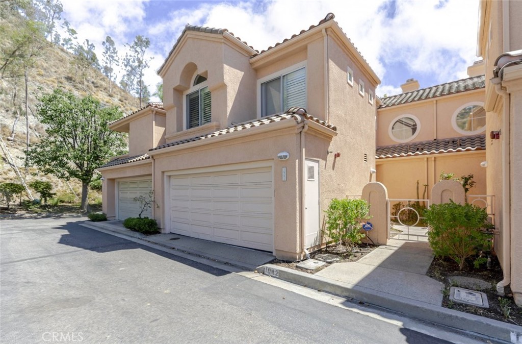 Welcome to 1942 Caminito De La Valle, a beautifully maintained 3-bedroom, 2.5 bathroom townhome offering 1,776 sq ft of stylish and functional living space in one of Glendale's most desirable neighborhoods. This spacious two-story home features an open layout with a bright living area, elegant dining space, and a well-appointed kitchen with stainless steel appliances, along with an attached 2-car garage providing direct access and extra storage. Upstairs, you'll find generously sized bedrooms, including a serene primary suite perfect for relaxing. Enjoy resort-style living with HOA amenities that include a pool, spa/hot tub, sauna, picnic area, playground, tennis courts, clubhouse, recreation room, and included insurance and front yard maintenance. Located near shopping, dining, parks, and within the top-rated Glendale Unified School District, this move-in-ready townhome offers the perfect blend of comfort, convenience, and community, don't miss the opportunity to make it yours.