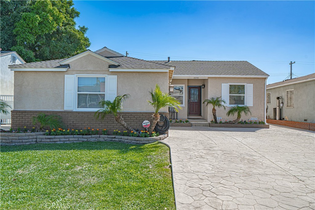 Home Is Where The Heart Is with this beautifully remodeled single-story home where comfort, function, and style come together. Thoughtful upgrades throughout make this property truly move-in ready, offering a lifestyle as practical as it is inviting. Inside, the home has been completely updated with newer flooring, crown molding, and tall baseboards that add a touch of elegance. The living room is anchored by a custom mantel and granite hearth. The remodeled kitchen features rich cabinetry, stone countertops, stainless steel appliances, and tile floors, opening seamlessly to the dining and living areas. Bedrooms offer newer carpet, ceiling fans, and abundant natural light, while the bathroom showcases tasteful tile finishes. Recessed lighting brightens the main living areas and primary suite, and a central media closet with conduits to every TV wall ensures future-proof convenience. All major systems have been addressed, including a tankless water heater, updated plumbing, newer main panel and subpanels, and upgraded electrical throughout. A larger central heating and A/C system, controlled by a Nest thermostat, keeps the home comfortable year-round with capacity for a future addition. A drop-down attic ladder leads to sheeted storage space, and details such as motion-sensor sconces, holiday light outlets, and updated water service with pressure regulator show the care that went into this home. The garage is a standout, finished with drywall and equipped for projects large and small. It includes two 220V plugs, built-in air lines with regulator and water separator, and extensive outlets and lighting. With its own sink, and urinal, it’s a true workshop setup. Step outside to a backyard made for entertaining and relaxation. A large gazebo with fans and lighting overlooks a custom gas firepit. The yard also features a playset for kids, while a 12’x16’ shed-barn with roll-up door, side entry, and sub panel provides incredible flexible space. Additional hardscaping expands the patio, and an extra-wide driveway offers plenty of parking. From top to bottom, this home blends modern upgrades with thoughtful extras, creating a turnkey property ready to enjoy for years to come.