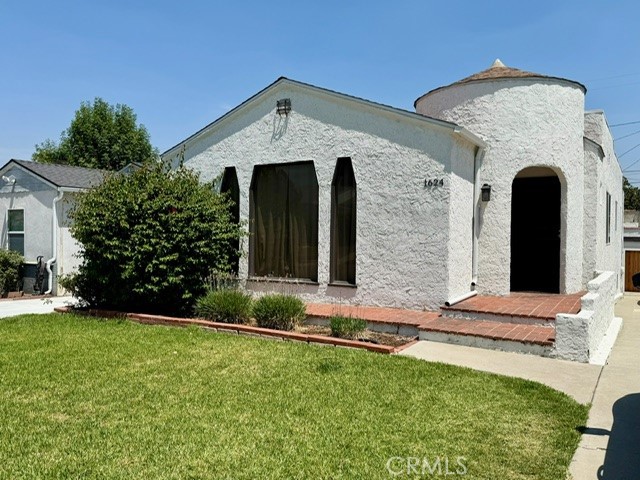 Remodeled Spanish home in desirable Alhambra neighborhood blends modern style with timeless architectural. Round tower entry leads to the impressive living room with tray styled high-ceilings, recessed lighting, brick fireplace and large picture windows that enhance the warmth and charm. The open floorplan flows into the spacious gathering room with contemporary dining area and beautifully renovated kitchen with quartz counters, wood center island, newer stainless appliances, countertop seating with 4 high stools and cozy banquette style breakfast table with built in benches. The additional room can be used as the 3rd bedroom, office or bonus room. Both bathrooms have been remodeled with tile floors, marble and quartz counters, skylight and recessed lighting. The tranquil backyard has a patio area and festive string lights. 2 car garage with module adjustable garage shelving and standalone shelves, extra refrigerator in the garage. This lovingly maintained home has been fully renovated with updated electrical, plumbing, central ac/heat, water softener system, reverse osmosis under sink water filtration system with dispenser, Lutron smart lighting, paint, flooring, washer/dryer, microwave, dishwasher, oven and refrigerator. This home is in a wonderful community, close to schools, restaurants, freeways and more.