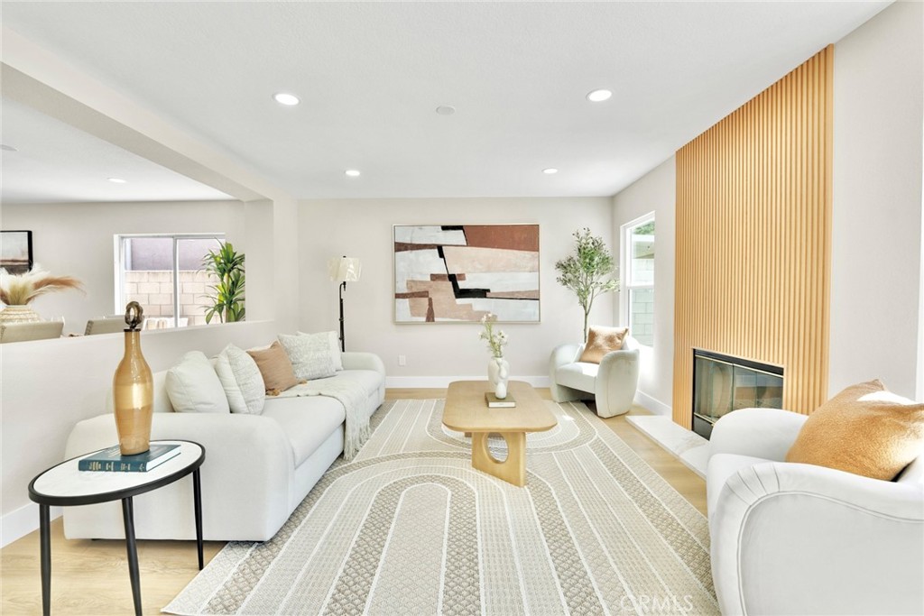 Welcome to this beautifully upgraded home in the prestigious gated community of Los Serranos, Chino Hills. Featuring 4 bedrooms and 2.5 baths, this residence offers an open and inviting floor plan with modern upgrades. Highlights include new vinyl plank flooring, fresh interior paint, energy-efficient windows, recess light thru out the house, and a fully remodeled kitchen with high-end Euro-style cabinetry, granite countertops, a center island, and designer lighting. The spacious kitchen flows seamlessly into the family room, creating the perfect setting for both everyday living and entertaining. Upstairs, the expansive primary suite offers walk-in closet and a private bath, and three additional bedrooms. Step outside to enjoy a low-maintenance backyard, ideal for relaxing and entertaining guests. Perfectly situated near shopping centers, restaurants, Chino Hills State Park, and within walking distance to Wickman Elementary School, this home offers contemporary elegance, thoughtful upgrades, and an unbeatable location.