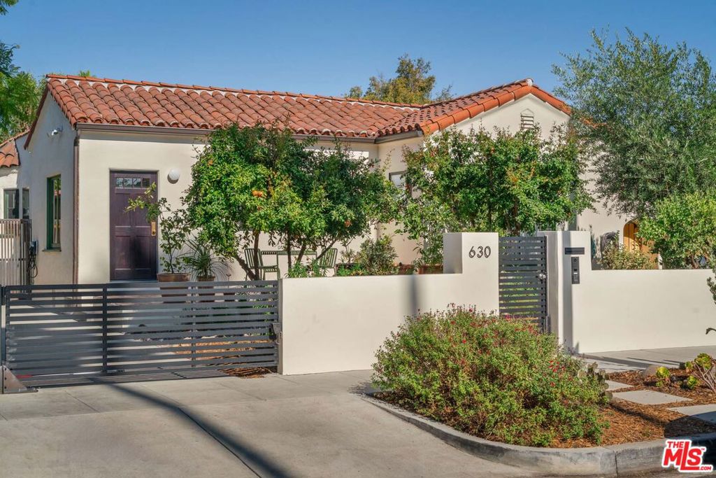 Welcome to Casa Vista, where architectural originality meets vibrant sophistication. This gated 4-bedroom, 3-bath masterpiece channels the spirit of Mexico City's modernist design, blending vibrant cultural energy with serene greenery. The living spaces flow seamlessly outdoors to a sunlit pool and lush garden, offering privacy and tranquility. Inspired by classic Mexican courtyard homes, this residence is a vibrant blend of architecture, nature, and indoor-outdoor living at its finest. The large kitchen is equipped with a Wolf gas stove and oven. The detached garage offers flexibility ideal for storage, a home office, or a creative studio. With an electric car charger and located just steps from premier dining and shopping, this secure, stylish sanctuary is a rare find. This home is equipped with a front camera & an alarm system as well as an electric car charger. Can be delivered furnished or unfurnished.